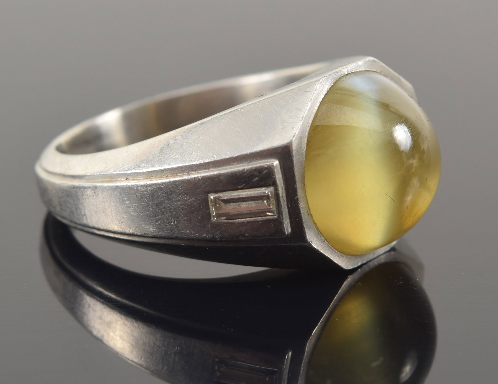 Platinum cat's eye chrysoberyl and diamond mounted ring. Natural round cabochon cat's eye stone (1 of 9)