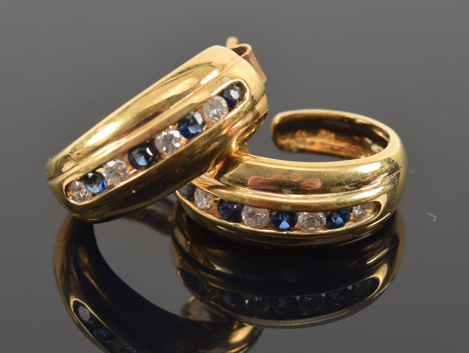 18K gold sapphire and diamond set J-hook earrings. Marked 750. 5/8in length. 6.1 grams.: 18K gold sapphire and diamond set J-hook earrings. Marked 750. 5/8in length. 6.1 grams.