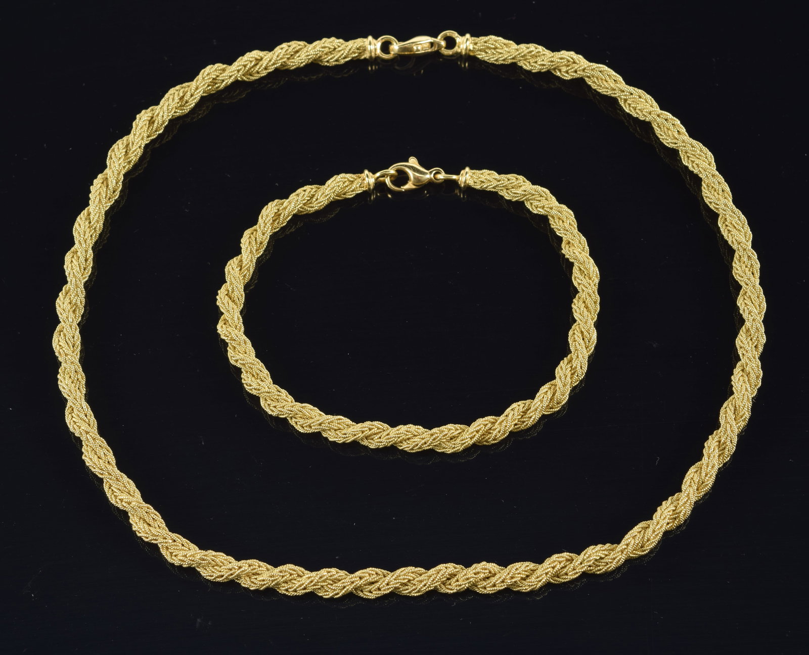 18K gold matching braided necklace and bracelet set. Clasps marked 750, Italy, and additional mark. (1 of 6)