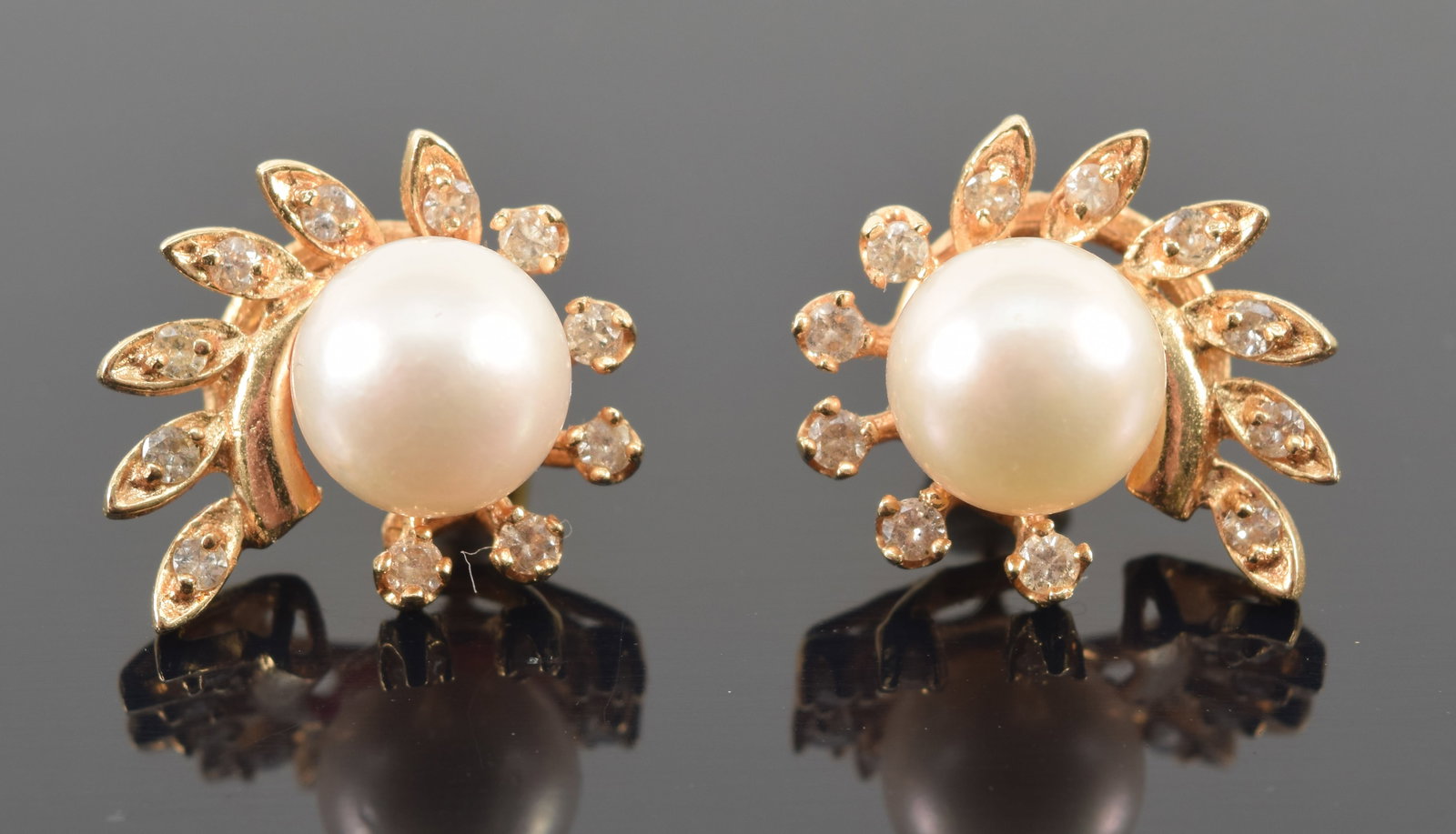 14K gold pearl and diamond swirl form stud earrings. Pearls each about 8mm diameter. Posts marked. (1 of 3)