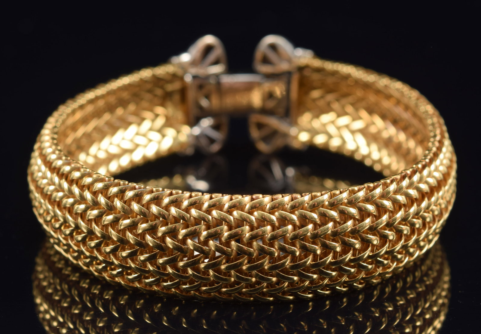 18k yellow and white gold braided mesh bracelet. Buckle form clasp. Marked 18K Italy. 7in length.: 18k yellow and white gold braided mesh bracelet. Buckle form clasp. Marked 18K Italy. 7in length. 36.9 grams.