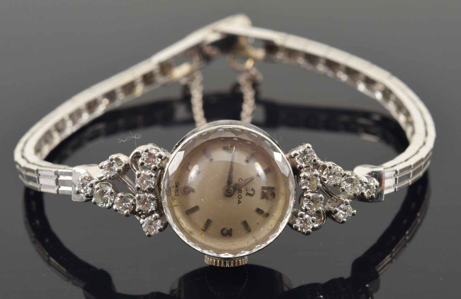 14K white gold Omega vintage ladies' wristwatch set with diamonds. Swiss movement. Clasp marked 14K.: 14K white gold Omega vintage ladies' wristwatch set with diamonds. Swiss movement. Clasp marked 14K. Openwork setting of 16 round cut diamonds, each measuring about 2.4mm. 18.7 grams.