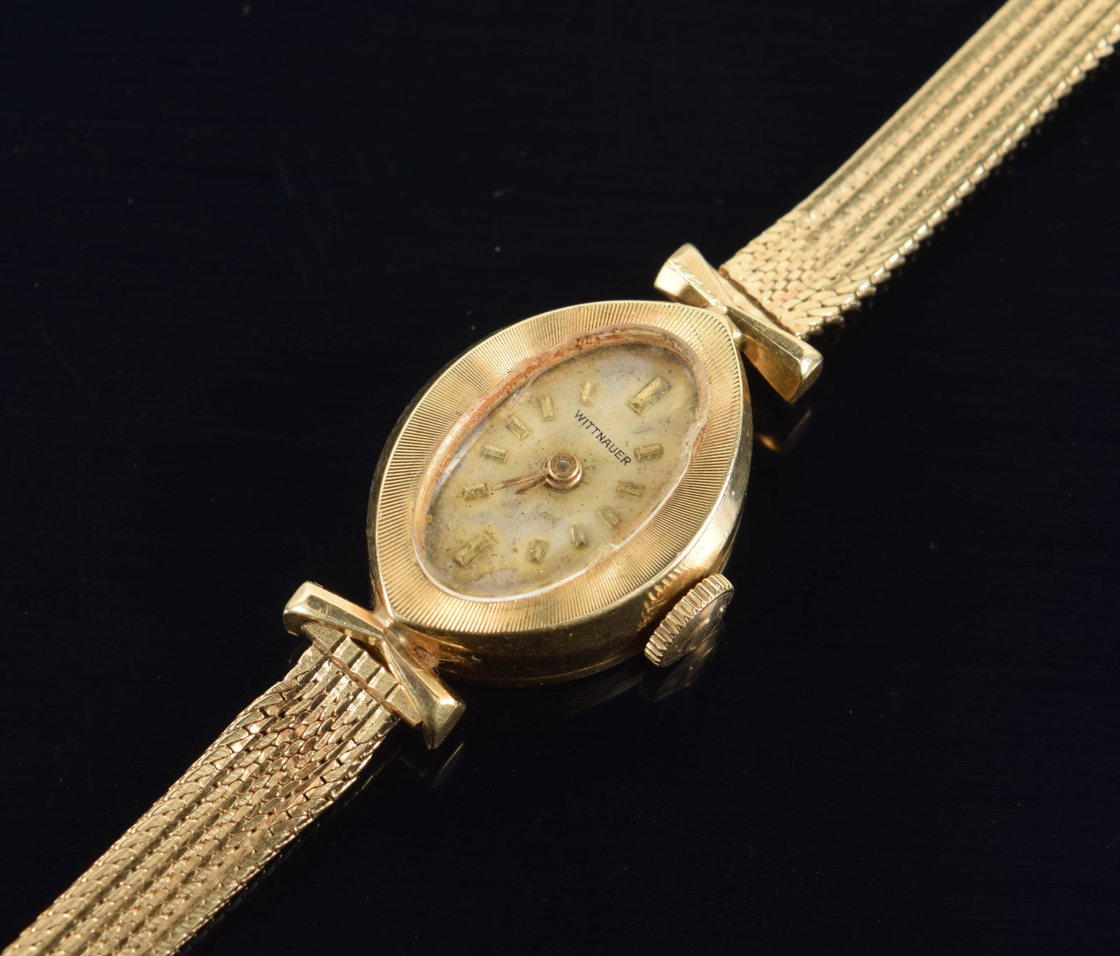 Wittnauer 14K gold vintage ladies' wristwatch. Marked on backside of case. Clasp marked 14K: Wittnauer 14K gold vintage ladies' wristwatch. Marked on backside of case. Clasp marked 14K Wittnauer France. Mesh band bent slightly near case. 6.75in length. 15.8 grams.