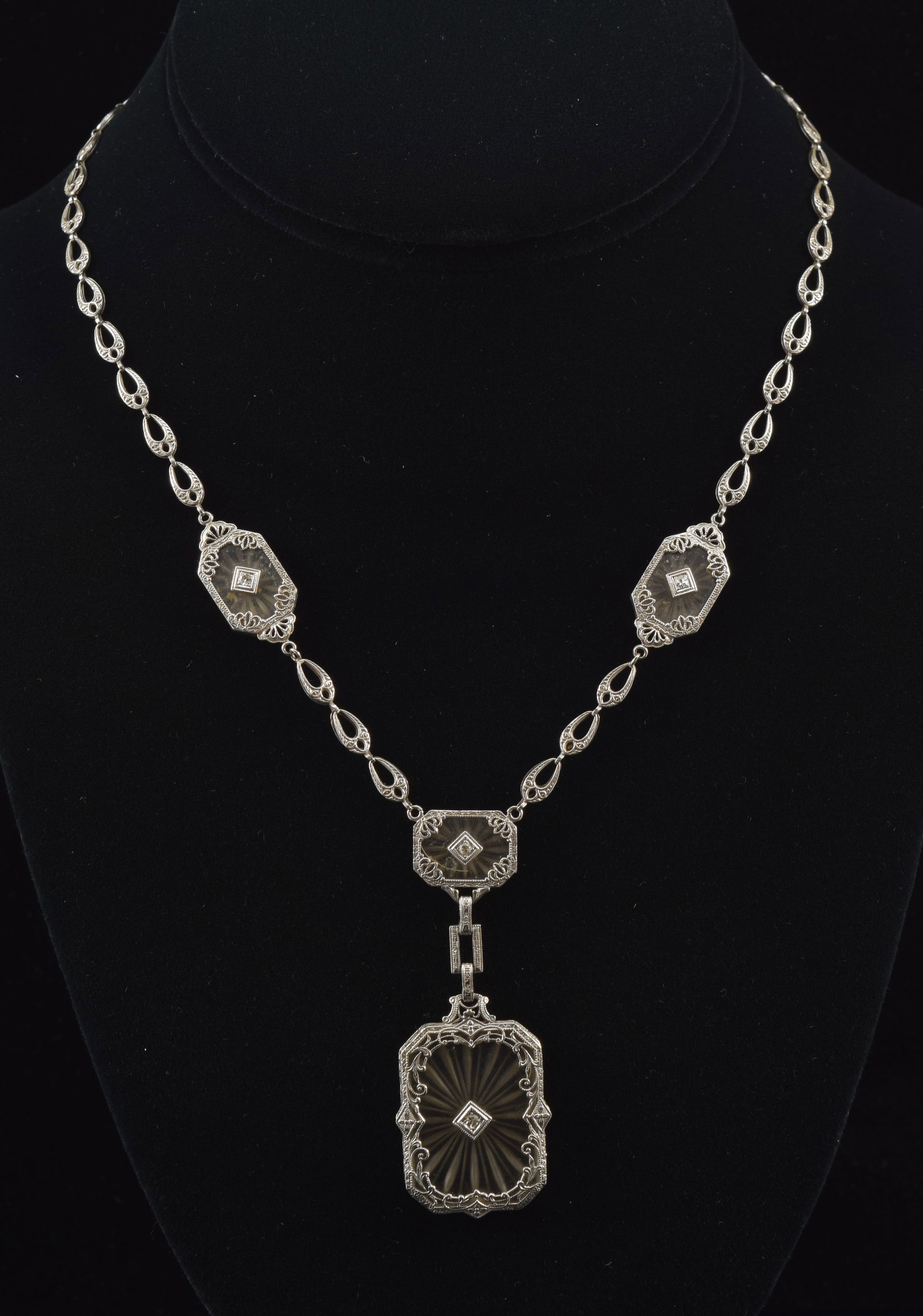 Antique 14K white gold diamond and etched crystal pendant necklace. Stylized teardrop chain. Each: Antique 14K white gold diamond and etched crystal pendant necklace. Stylized teardrop chain. Each crystal plaque set with a round cut diamond. Chain length: 15in. 13.1 grams.