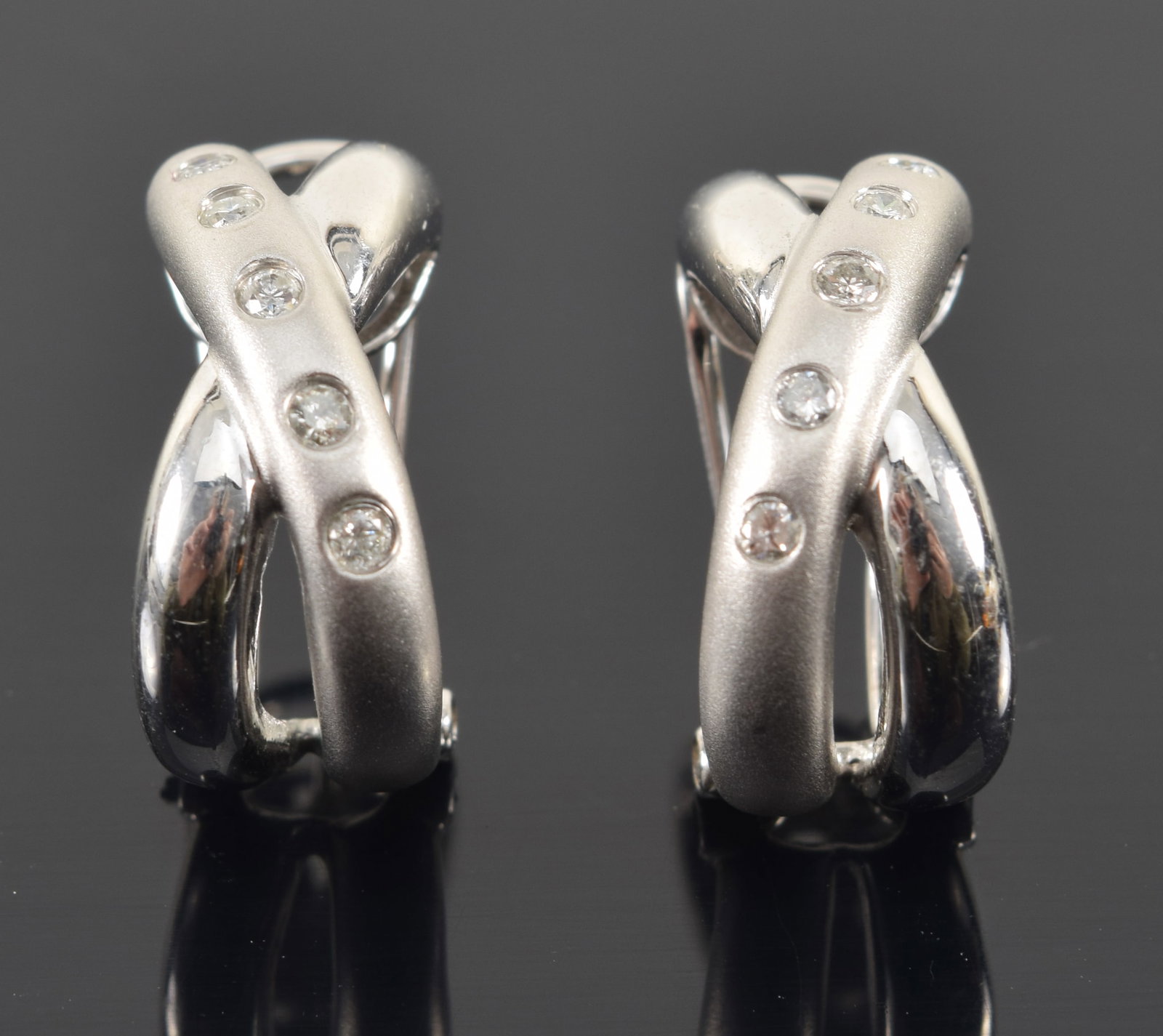 14K white gold "X" form diamond mounted huggy style clip earrings. Polished and satin form bands, (1 of 4)