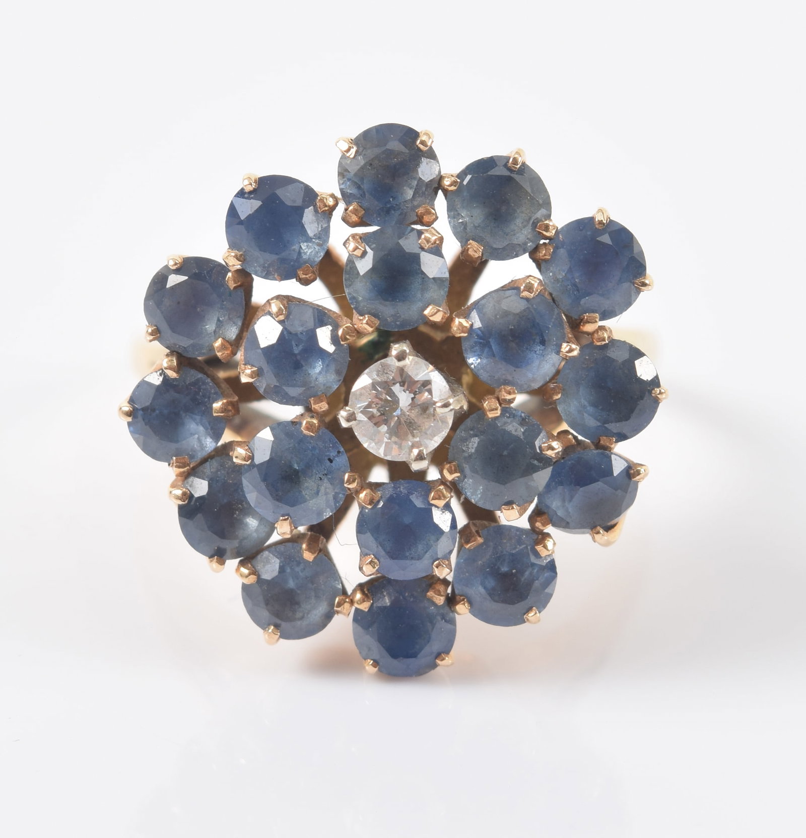 14K gold sapphire and diamond ring. Central round cut diamond (2.8mm diameter) surrounded by 2 (1 of 7)