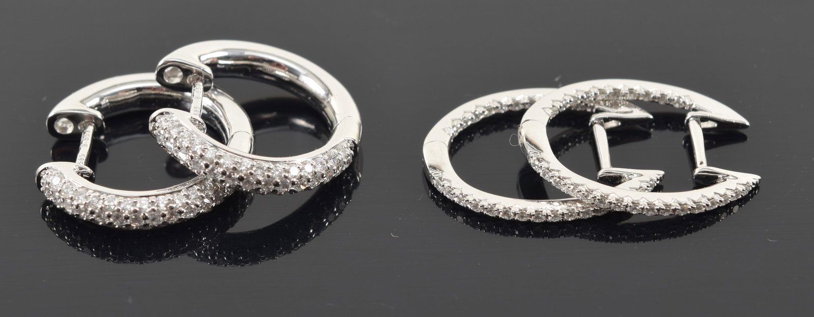 2 pairs of 14K white gold diamond melee earrings. Each about 0.75in length. 6 grams.: 2 pairs of 14K white gold diamond melee earrings. Each about 0.75in length. 6 grams.