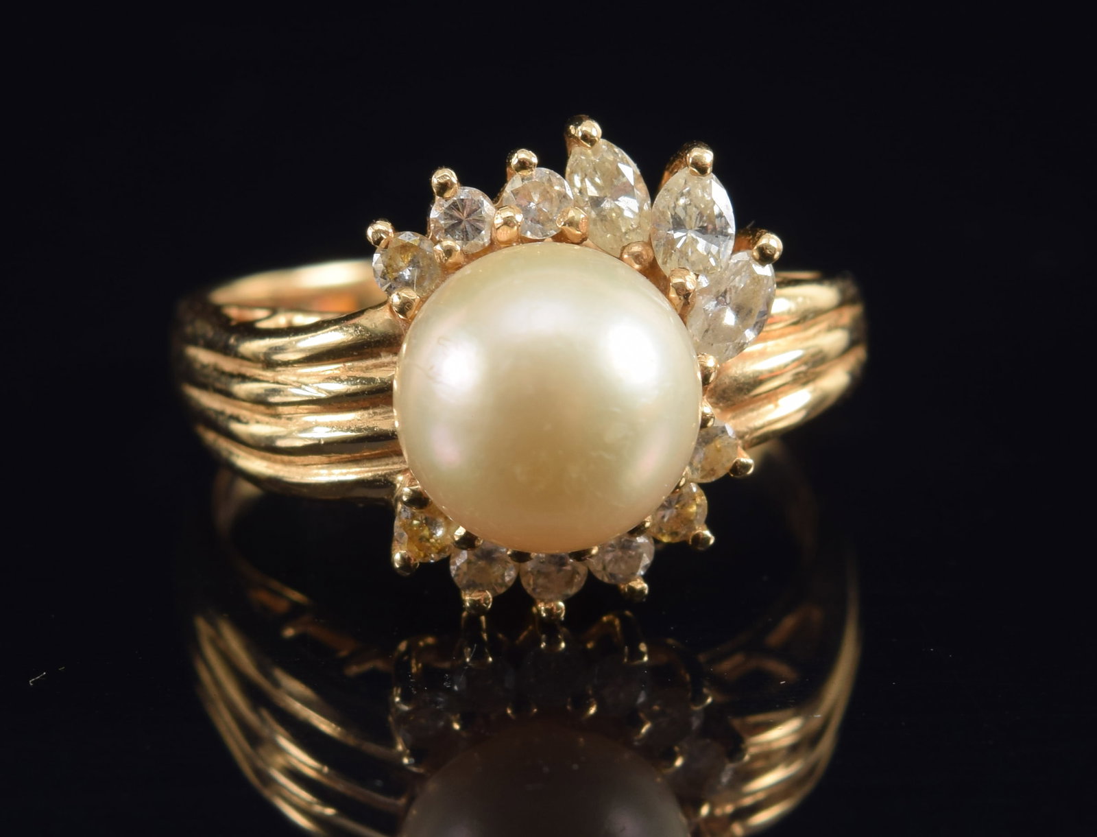 14K gold pearl solitaire ring surrounded by a partial graduated flare of diamonds. Marked 14K. Ring (1 of 5)