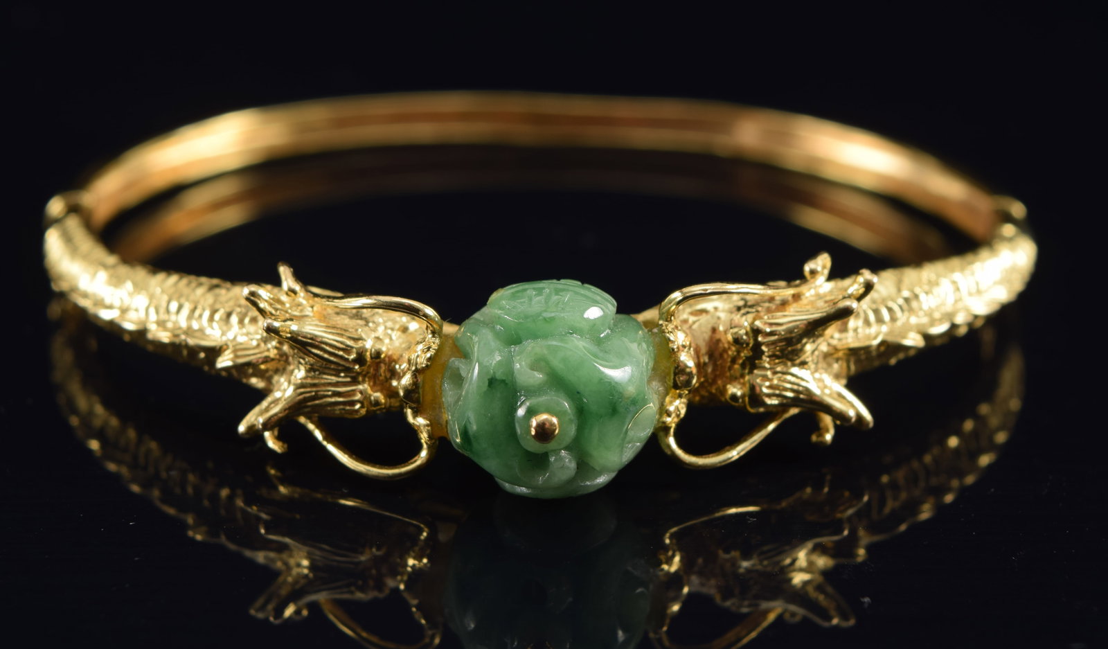 18K gold jade dragon form hinged bangle bracelet. 2 dragons flanking a carved green jade celestial (1 of 5)