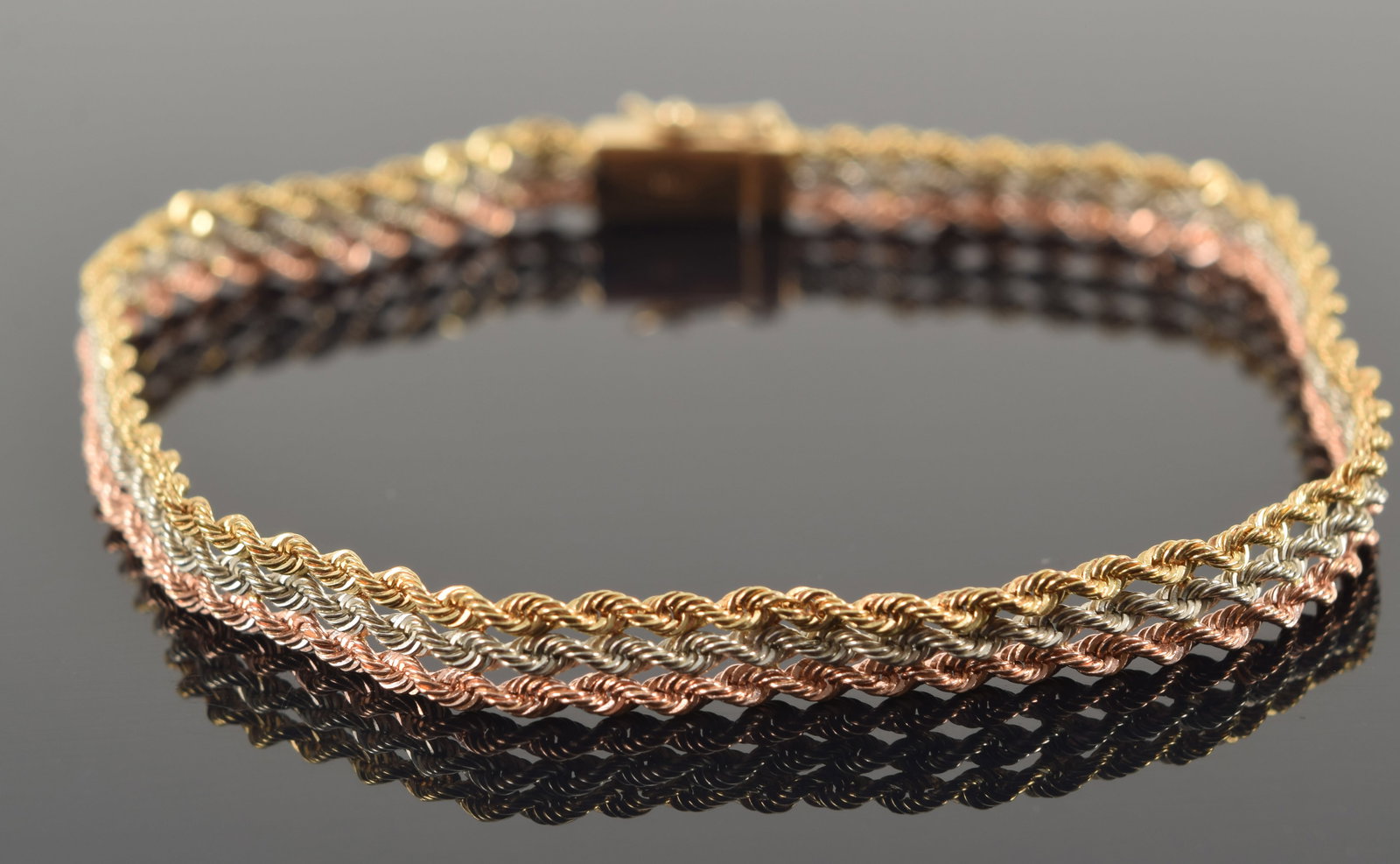 14K tri-color gold rope twist of 3 strands. Clasp marked 14K. 7in length. 5 grams.: 14K tri-color gold rope twist of 3 strands. Clasp marked 14K. 7in length. 5 grams.
