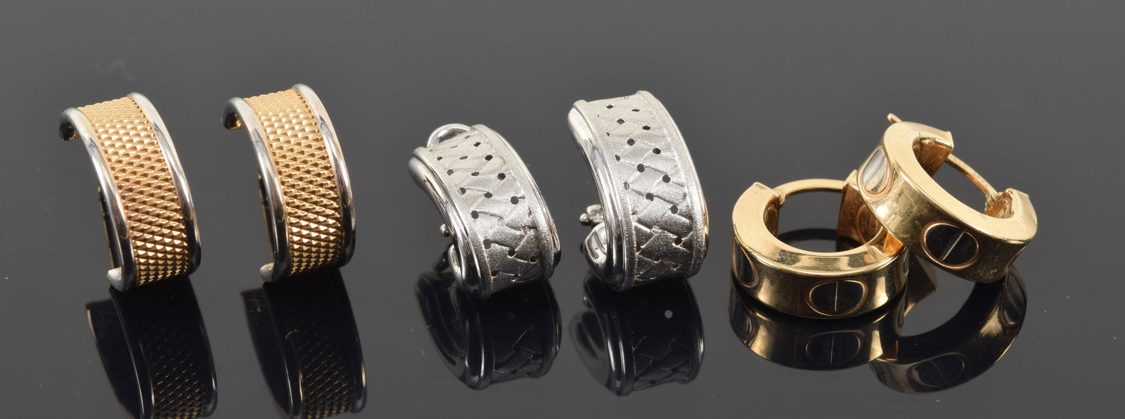 3 pairs of gold earrings. To include: 1) 18K white gold pierced woven design clip earrings. 4.7 (1 of 5)