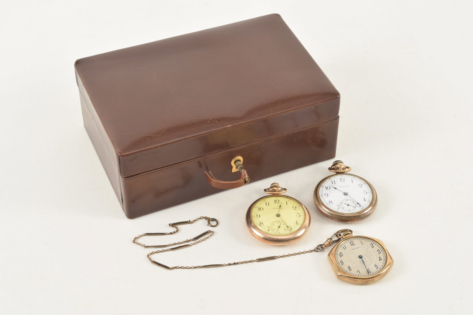 3 antique Waltham gold filled pocket watches together with a Brooks Brothers leather jewelry box.: 3 antique Waltham gold filled pocket watches together with a Brooks Brothers leather jewelry box.