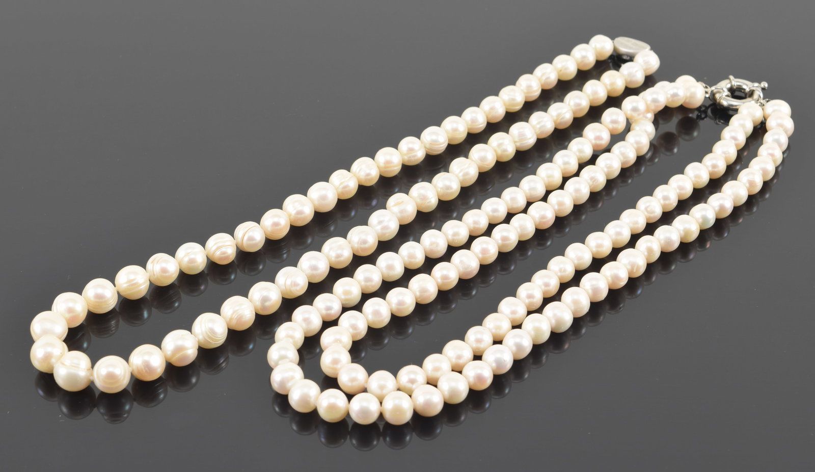 2 pearl necklaces. 1) Freshwater pearl necklace with sterling silver clasp. Pearls about 10mm (1 of 5)