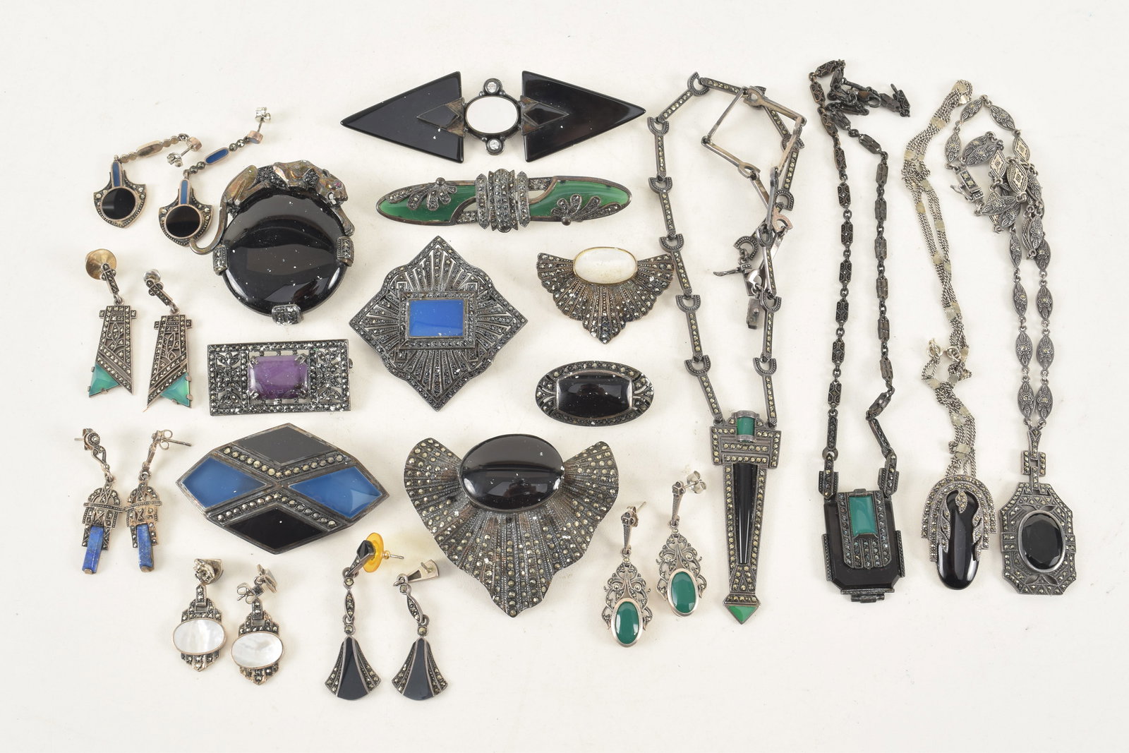 Large lot of vintage signed Art Deco sterling silver jewelry. All pieces mounted with marcasite and: Large lot of vintage signed Art Deco sterling silver jewelry. All pieces mounted with marcasite and other stones, including chalcedony, lapis, onyx, etc. To include: 6 pairs of earrings, 10 pins, and 