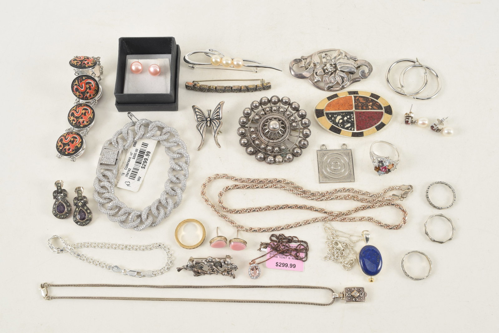 Selection of silver jewelry items. To include: lapis lazuli pendant necklace, diamond pave bracelet, (1 of 7)