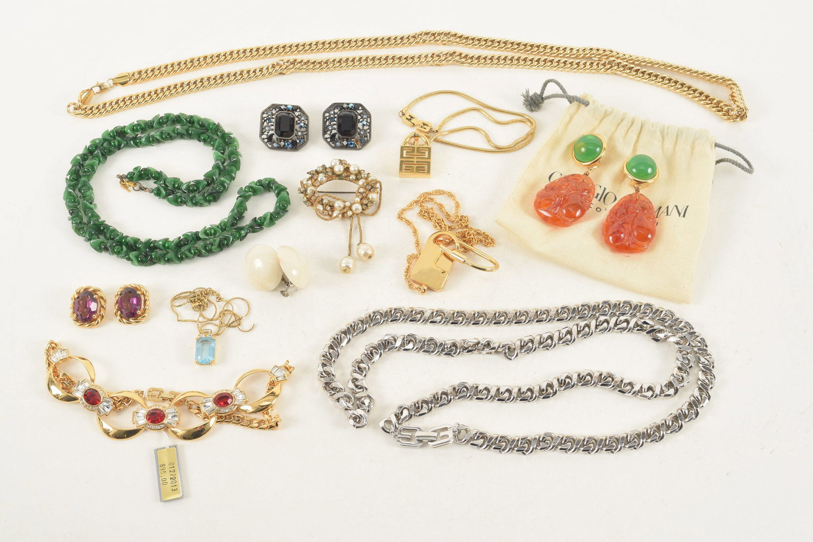 Lot of designer fashion jewelry, including: 1) Givenchy earrings and locket necklace, large chain: Lot of designer fashion jewelry, including: 1) Givenchy earrings and locket necklace, large chain link necklace. 2) Cascio Bijoux gold link necklace. 3) Miriam Haskell pearl brooch and earrings. 4) Gi