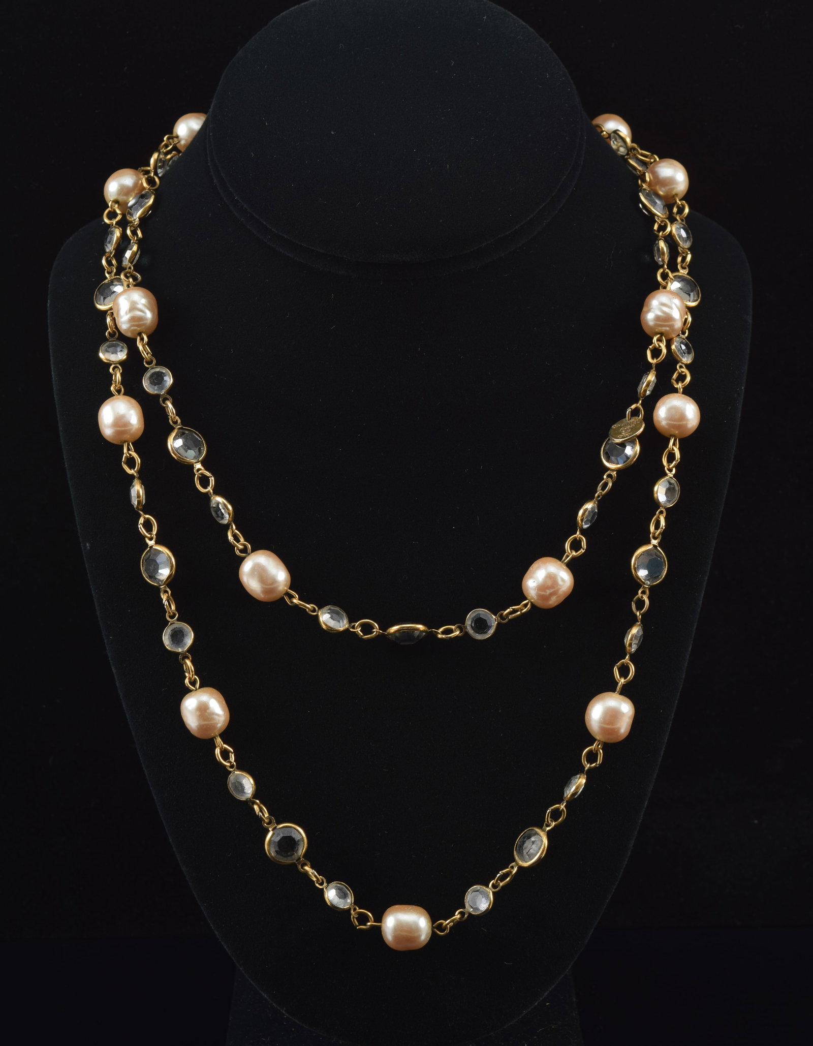 Vintage Chanel pearl and strass eternity necklace. 37in length. Marked on tag Chanel with copyright: Vintage Chanel pearl and strass eternity necklace. 37in length. Marked on tag Chanel with copyright 1981.
