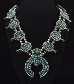 Southwest Zuni silver and turquoise squash blossom necklace. Intricate turquoise pave medallions and