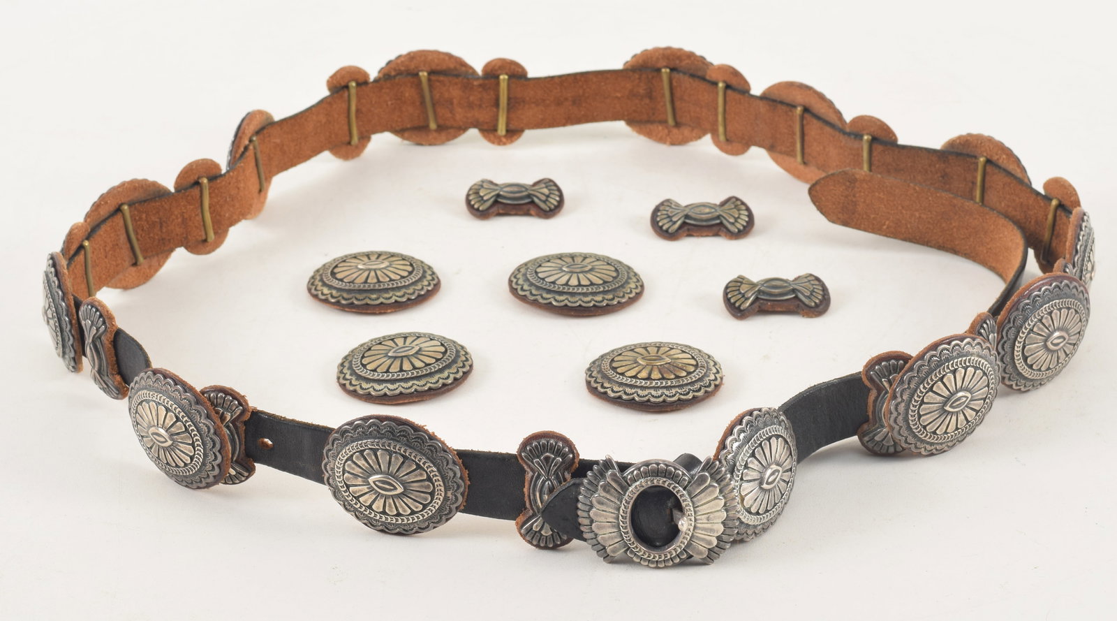 Southwest Native American silver concho belt with additional medallions. Buckle signed SD, 925, and: Southwest Native American silver concho belt with additional medallions. Buckle signed SD, 925, and S. Fe.