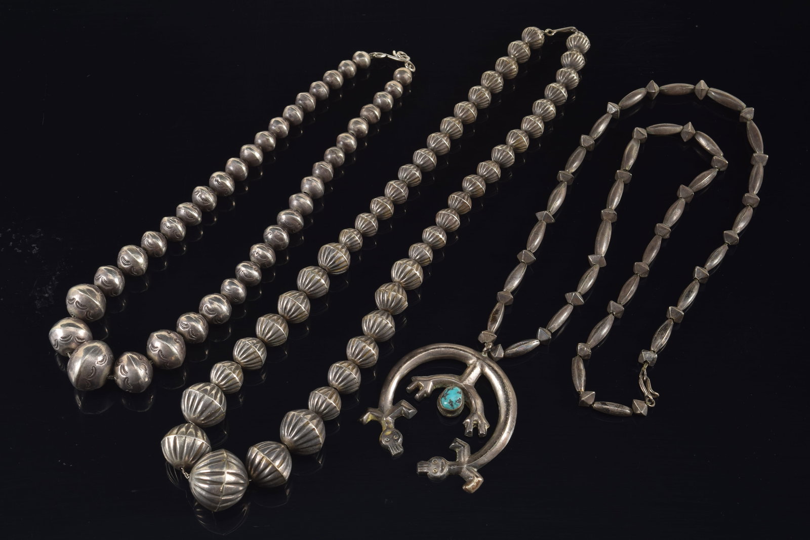 Lot of 3 early southwest Native American silver necklaces. 1) Lizard form pendant necklace, set with (1 of 6)
