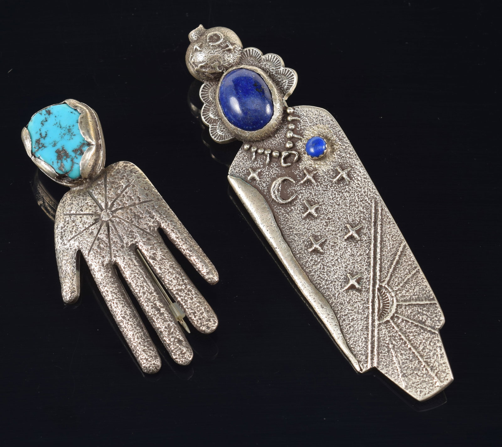 2 Santa Domingo Pueblo southwest sterling silver jewelry pieces, possibly by Tony Aguilar. 1) Large: 2 Santa Domingo Pueblo southwest sterling silver jewelry pieces, possibly by Tony Aguilar. 1) Large figural form pin/pendant with day and night scene with sun and stars on the body, and head decorated