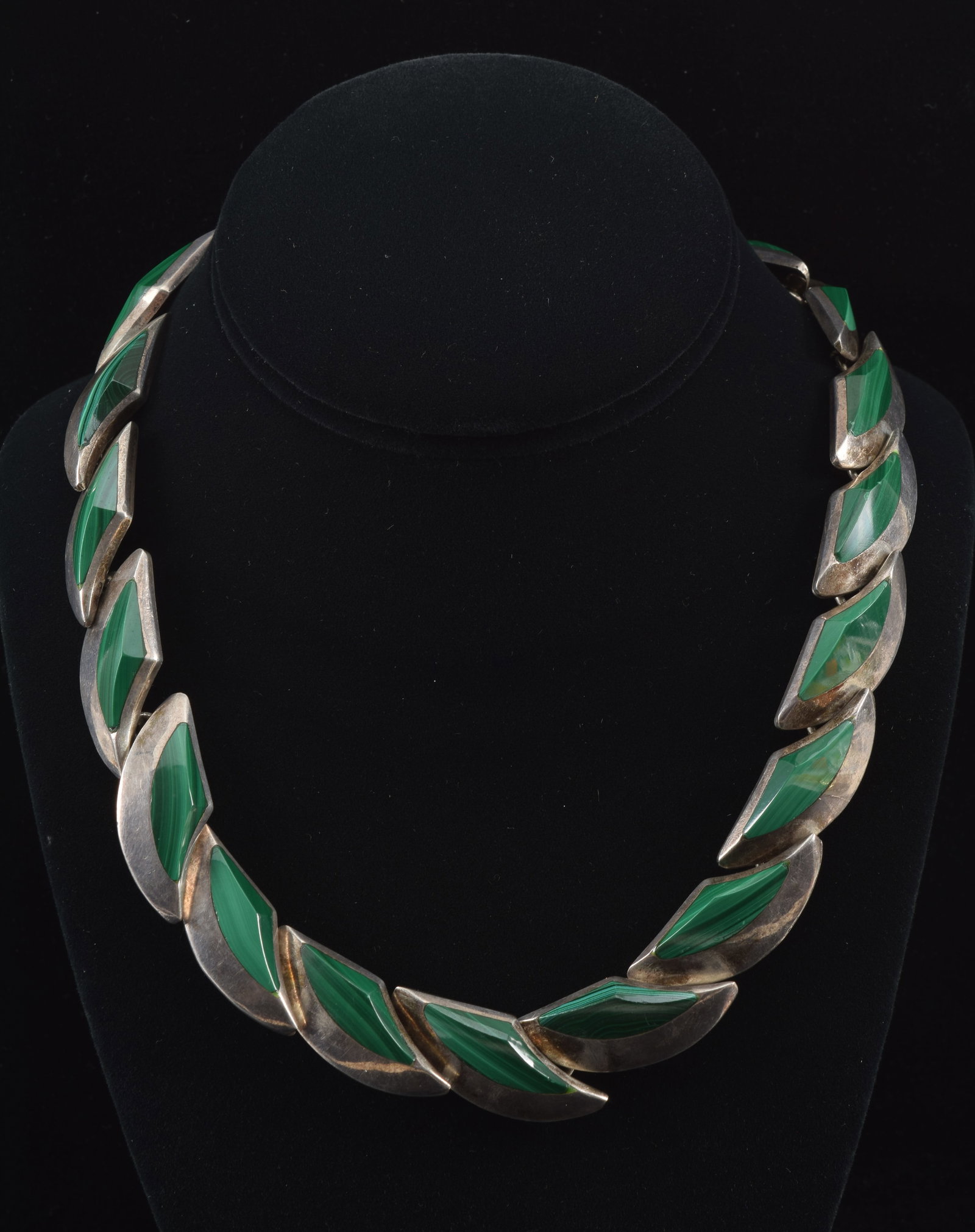 Taxco Mexican 950 silver and malachite necklace. Mid century modern link design with contoured and: Taxco Mexican 950 silver and malachite necklace. Mid century modern link design with contoured and faceted malachite stones. Clasp marked TN-57 Mexico 950. When clasped, 5.25in diameter of interior. 5