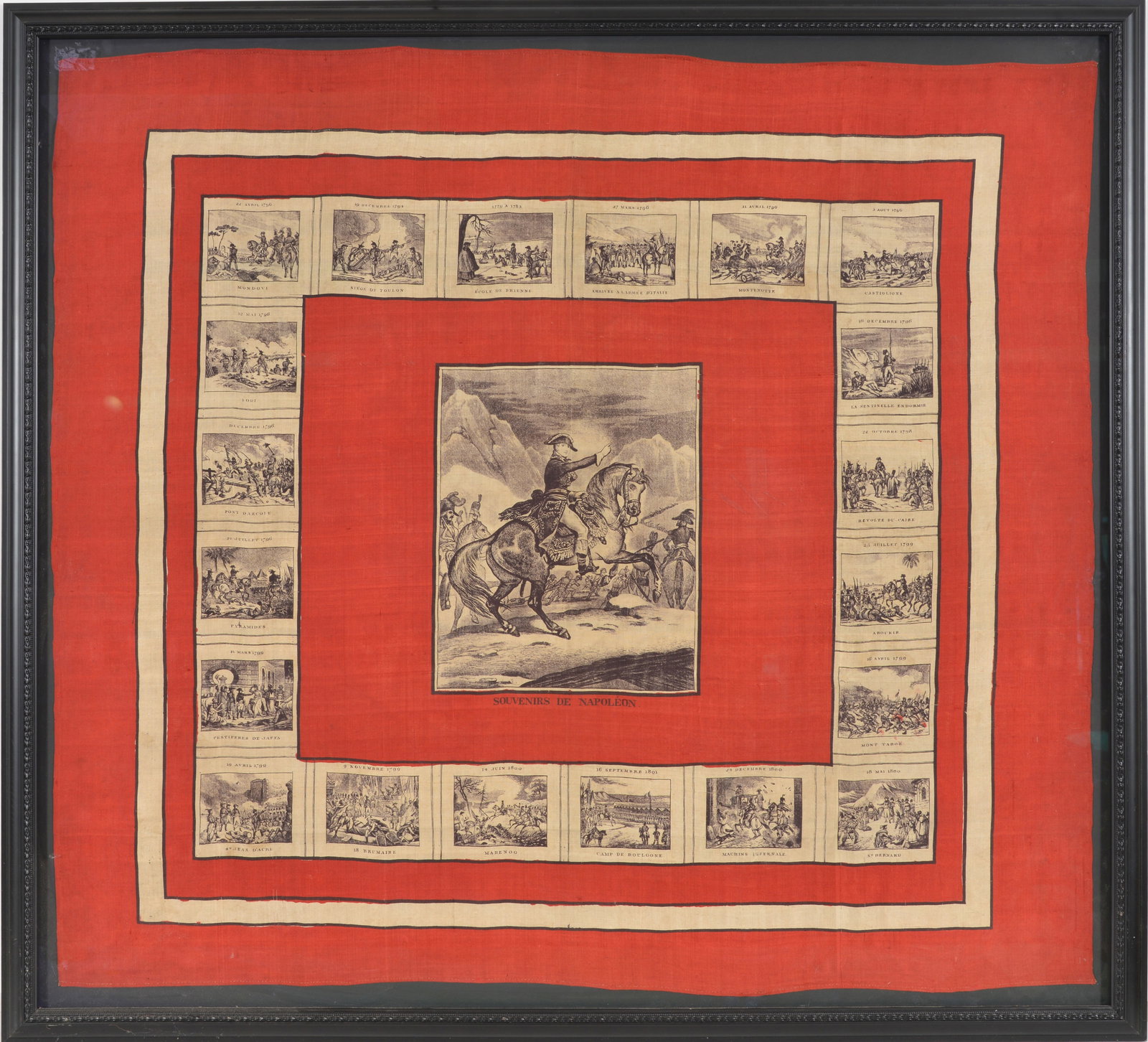 19th century Napoleonic handkerchief "Souvenirs de Napoleon". Printed on silk(?) textile. Central: 19th century Napoleonic handkerchief "Souvenirs de Napoleon". Printed on silk(?) textile. Central scene of Napoleon crossing the Alps and surrounded by a border of the General's famous battles. Framed