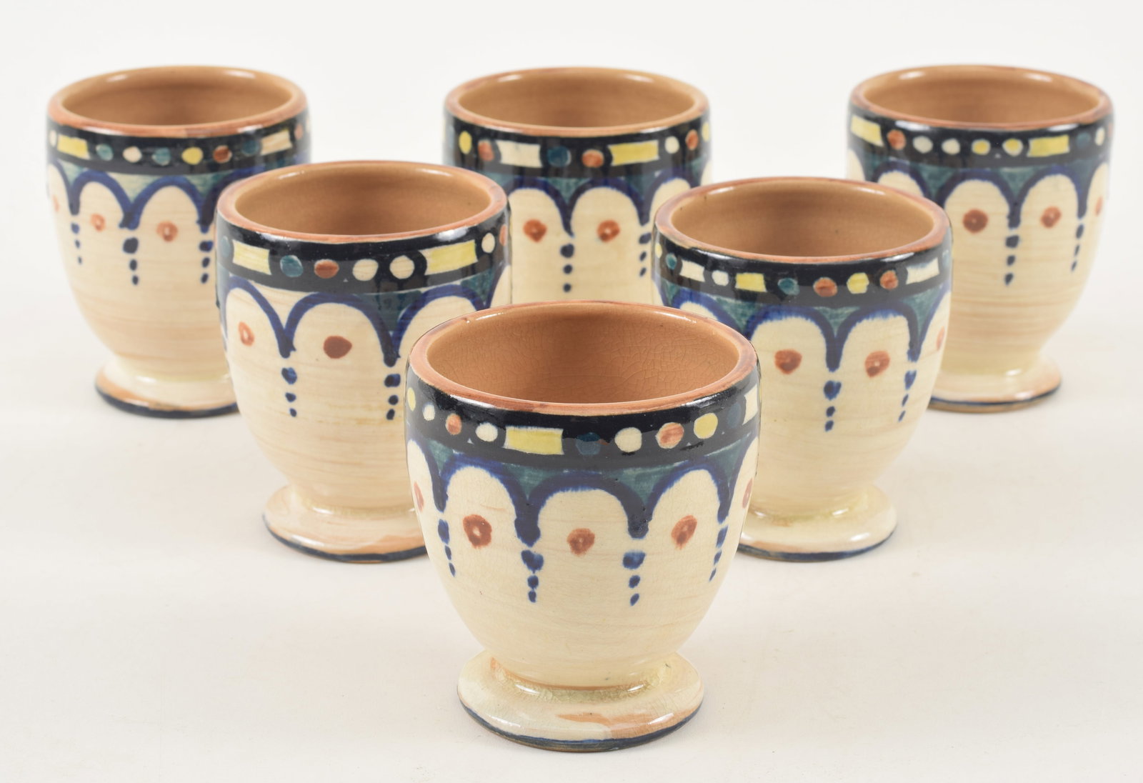Shearwater Pottery set of 6 glazed earthenware footed cups. Arcade pattern in colors around the (1 of 3)