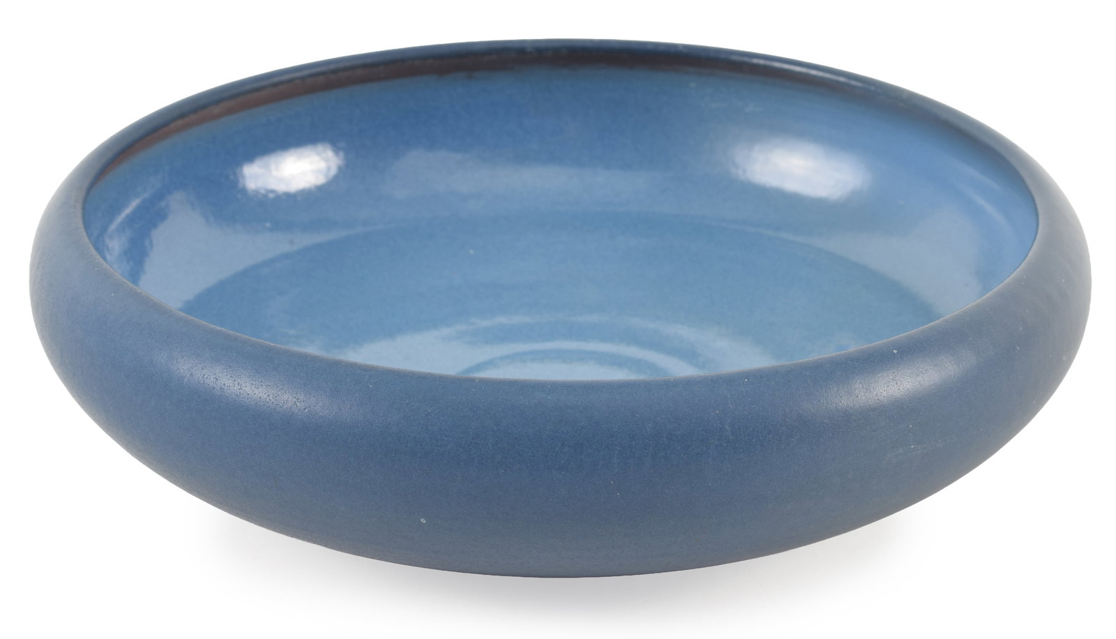 Marblehead Pottery arts & crafts ceramic low bowl in deep lilac blue glaze. Impressed mark on the: Marblehead Pottery arts & crafts ceramic low bowl in deep lilac blue glaze. Impressed mark on the base. Very slight old glaze flake on rim. 8.75in diameter.