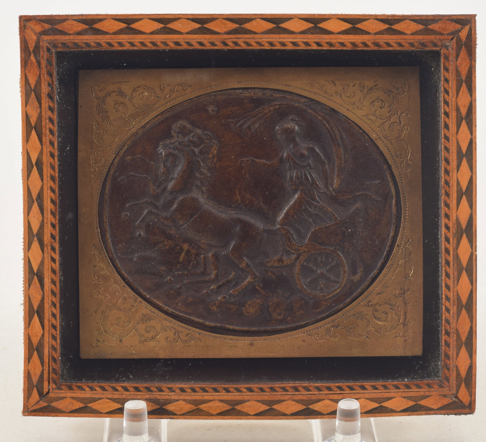 Classical style bronze oval plaque of Aurora with a gilded, engraved bezel and a marquetry frame,: Classical style bronze oval plaque of Aurora with a gilded, engraved bezel and a marquetry frame, 19th Century. 3 5/8 x 4 1/4 in.