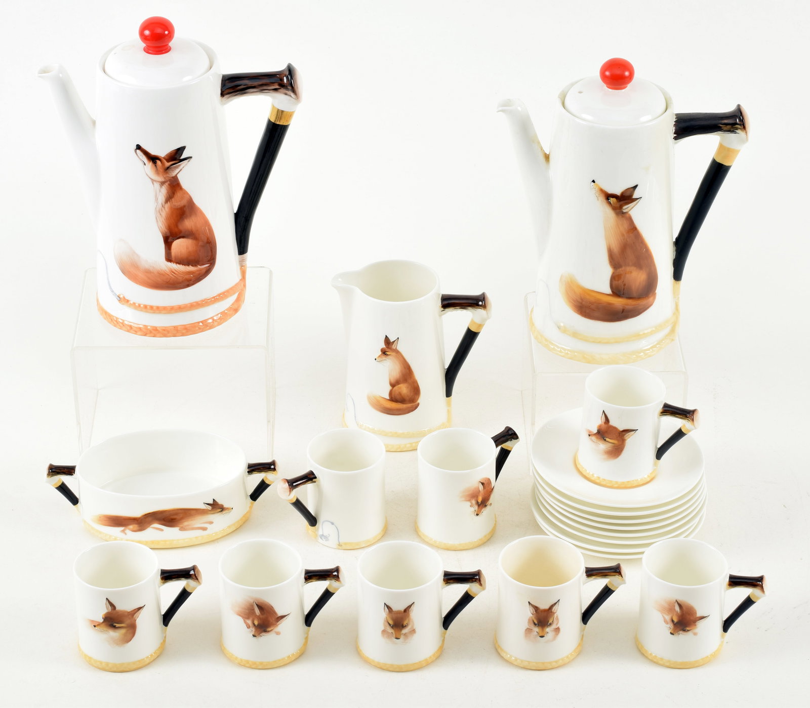 Royal Doulton coffee service in "Raynard the Fox" pattern including 2 coffee pots, creamer, open: Royal Doulton coffee service in "Raynard the Fox" pattern including 2 coffee pots, creamer, open sugar and 8 demi-tasses cups and saucers. Original coffee pot damaged and repair, second coffee pot new