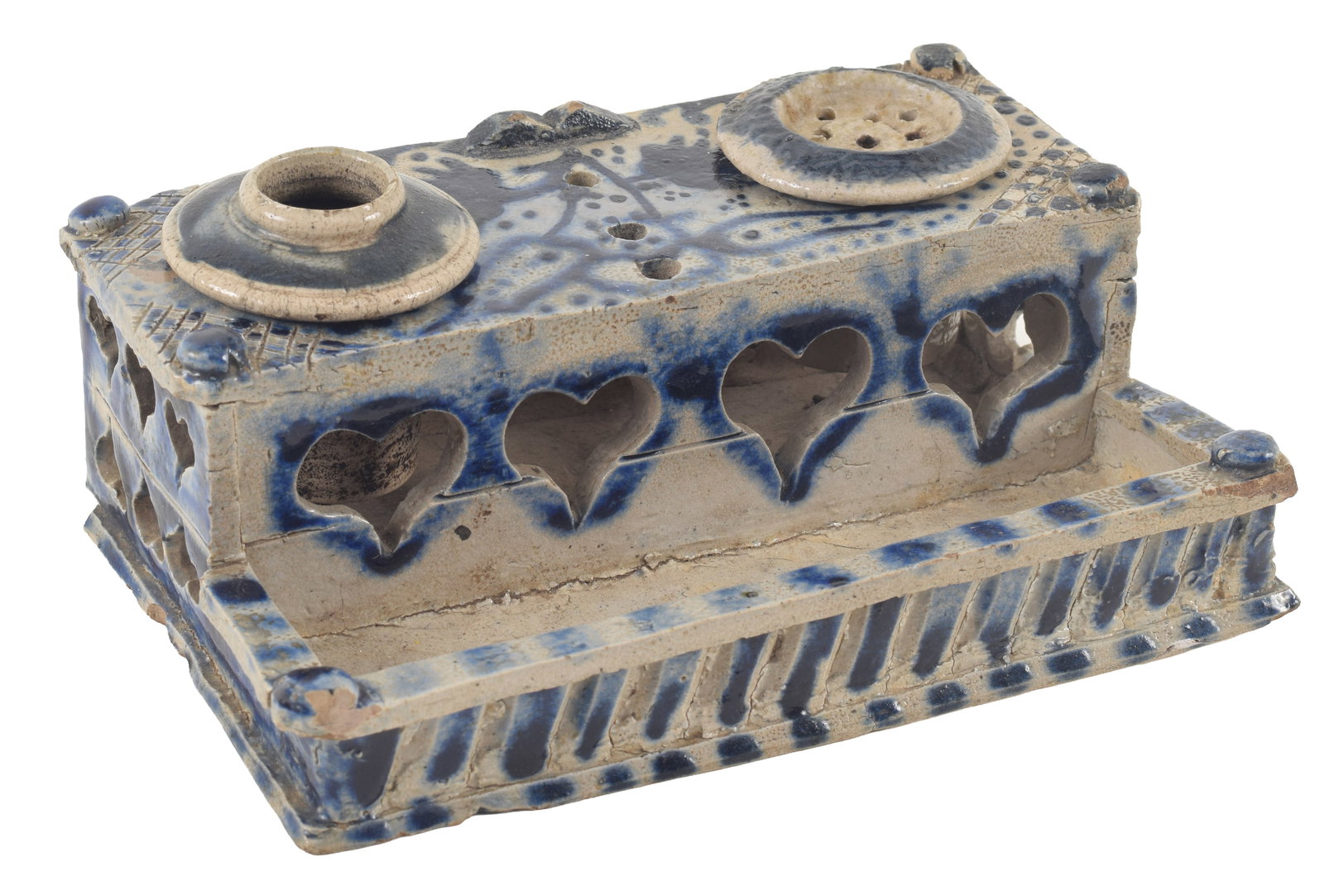 18th/19th century blue decorated stoneware ink stand with inserts. Intricate heart shape cut-out: 18th/19th century blue decorated stoneware ink stand with inserts. Intricate heart shape cut-out decoration. Chips around lower base. 6.5 W x 4.25 D x 2.625in H. Provenance: From the Rex Stark collect