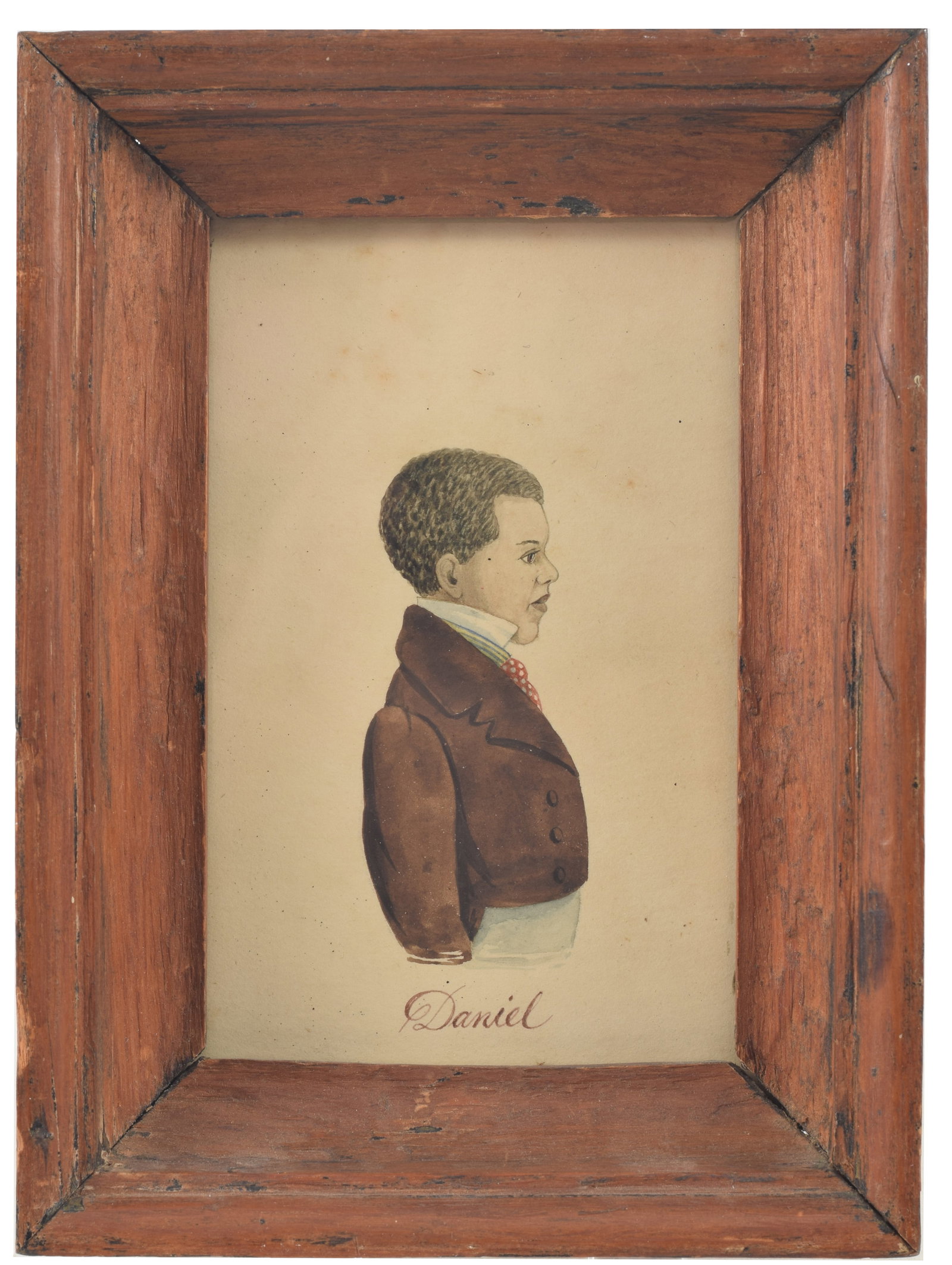 Mid 19th Century portrait of a young black boy in brown waist coat and polka dot tie, titled: Mid 19th Century portrait of a young black boy in brown waist coat and polka dot tie, titled "Daniel". Watercolor on paper, in early molded frame and marked on reverse with label Daniel Birk,1838. Lig