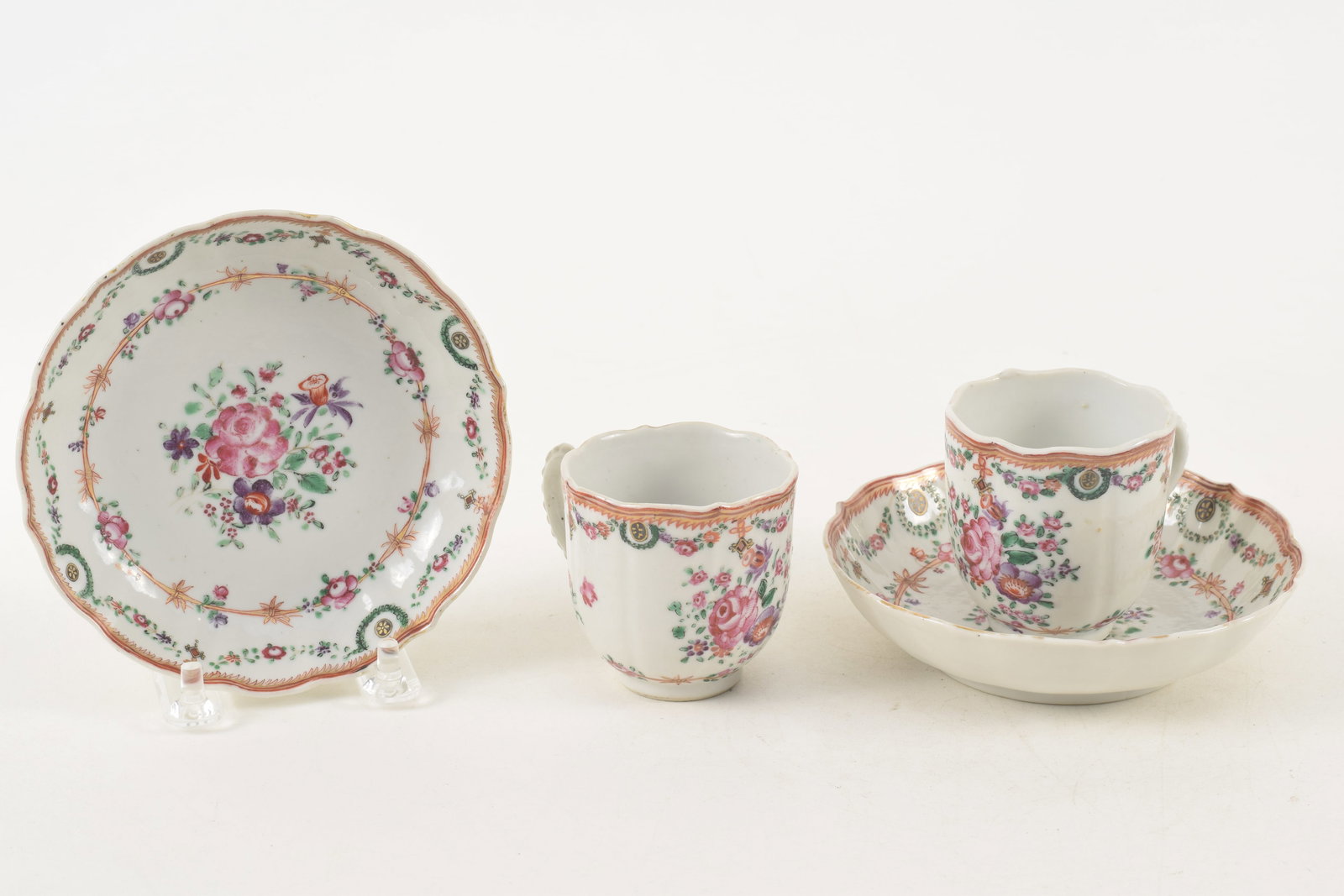 Pair of 18th century Chinese export porcelain cups and saucers with shaped rims. Floral decorations.: Pair of 18th century Chinese export porcelain cups and saucers with shaped rims. Floral decorations. 5in diameter saucers.
