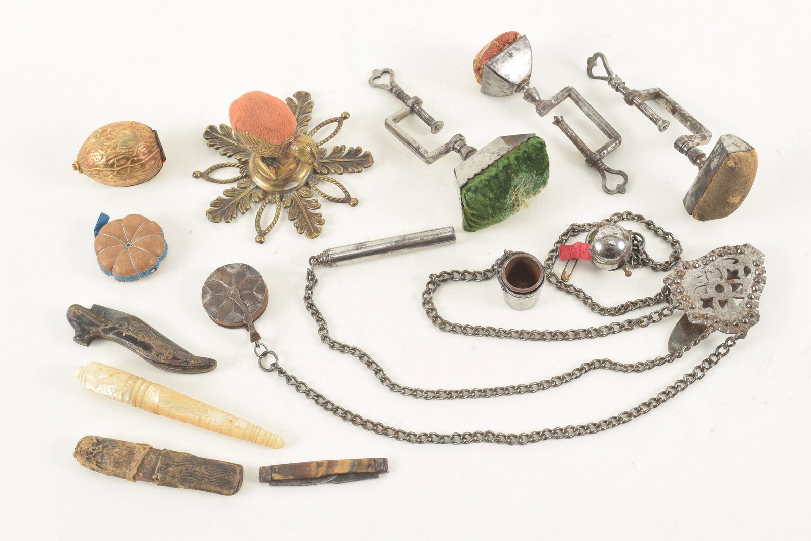 A collection of 19th Century sewing items, including a Victorian chatelaine, 3 early sewing birds, (1 of 8)