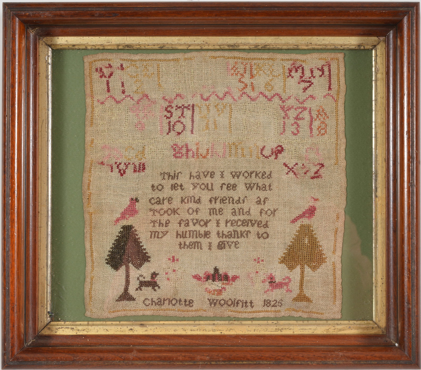 Needlework sampler signed and date Charlotte Woolfitt, 1826 with alphabet and motto above trees and: Needlework sampler signed and date Charlotte Woolfitt, 1826 with alphabet and motto above trees and animals. Framed and glazed. Size 10 x 10 in, overall size 15 1/2 x 13 1/2 in