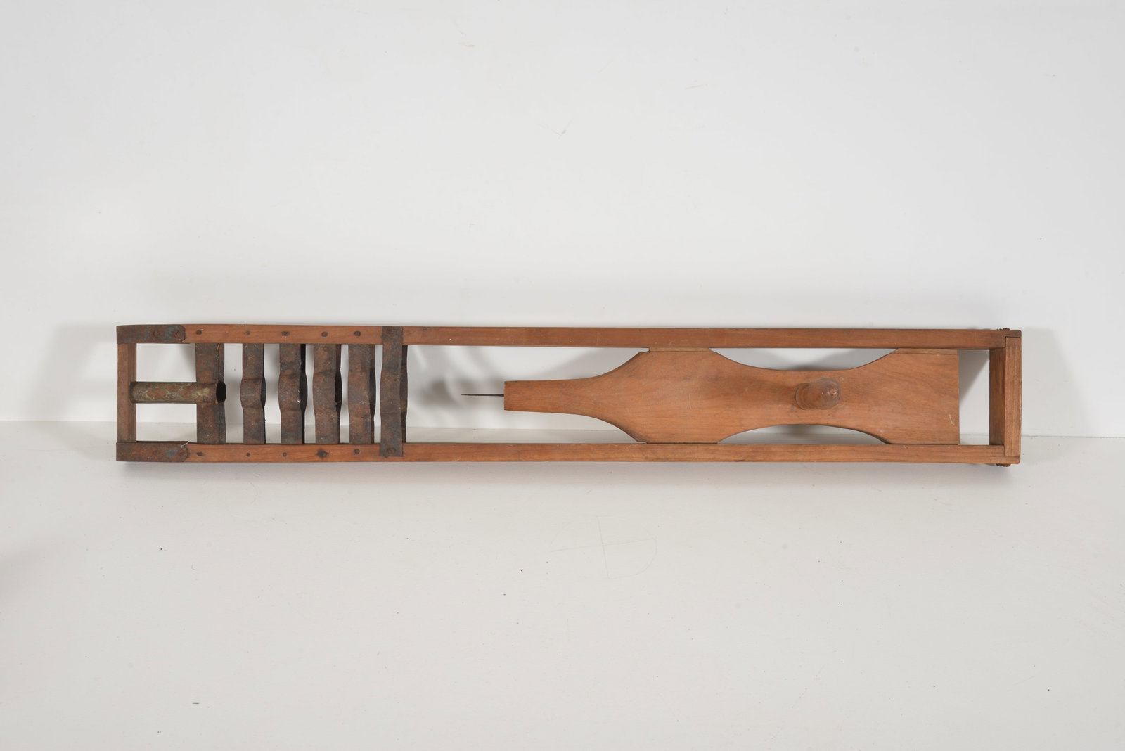 Shaker corn shucker with wooden frame holding shuttle and graduated cutting blades, 19th Century. 32: Shaker corn shucker with wooden frame holding shuttle and graduated cutting blades, 19th Century. 32 1/2 x 4 3/4 in.