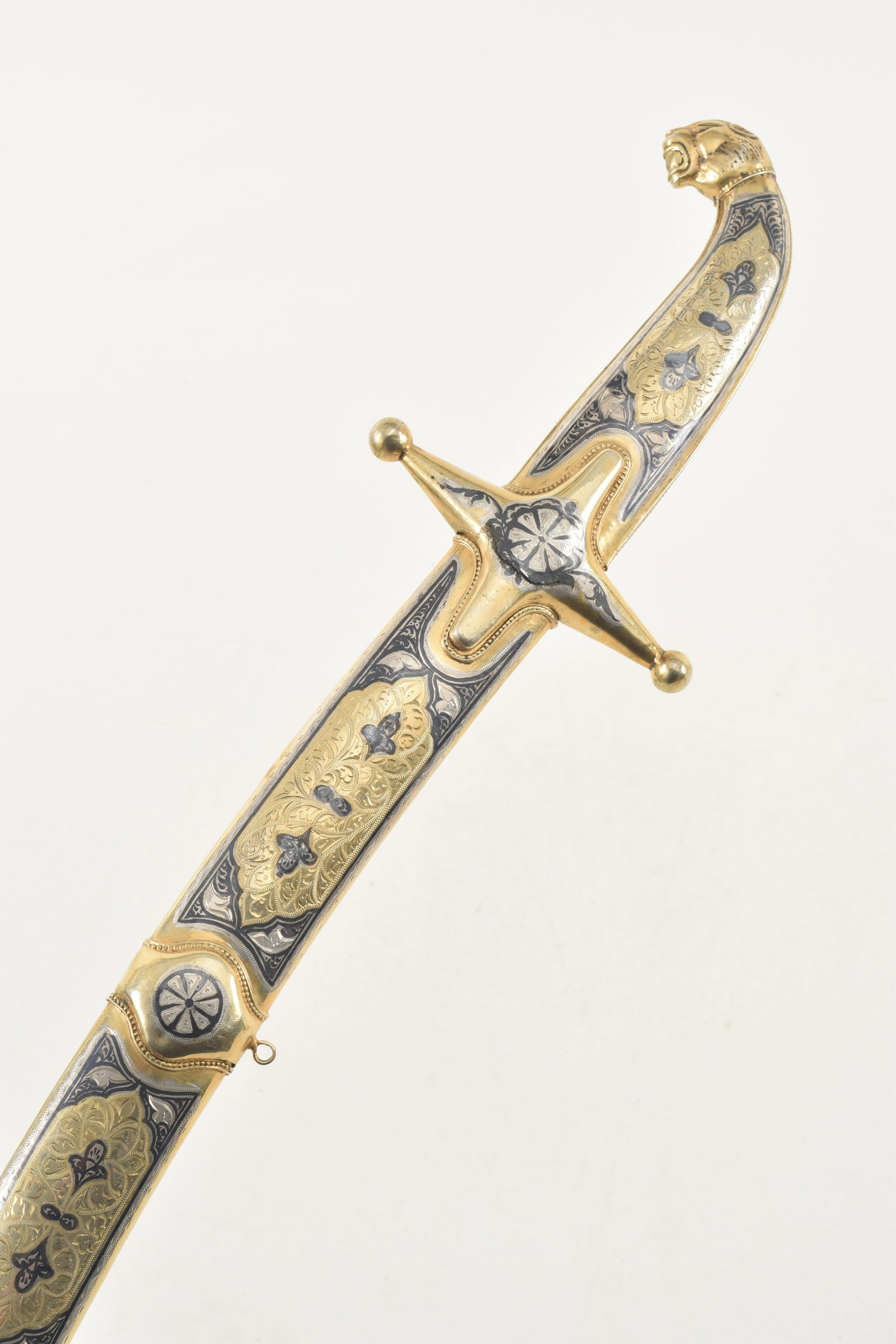 Striking, Russian, Caucasian Shamshir with Silver Mounts, 1930-1950s. Caucasian shamshir featuring a: Striking, Russian, Caucasian Shamshir with Silver Mounts, 1930-1950s. Caucasian shamshir featuring a gracefully curved plain polished blade measuring approximately 25.5 in. (64.8 cm), with an overall 