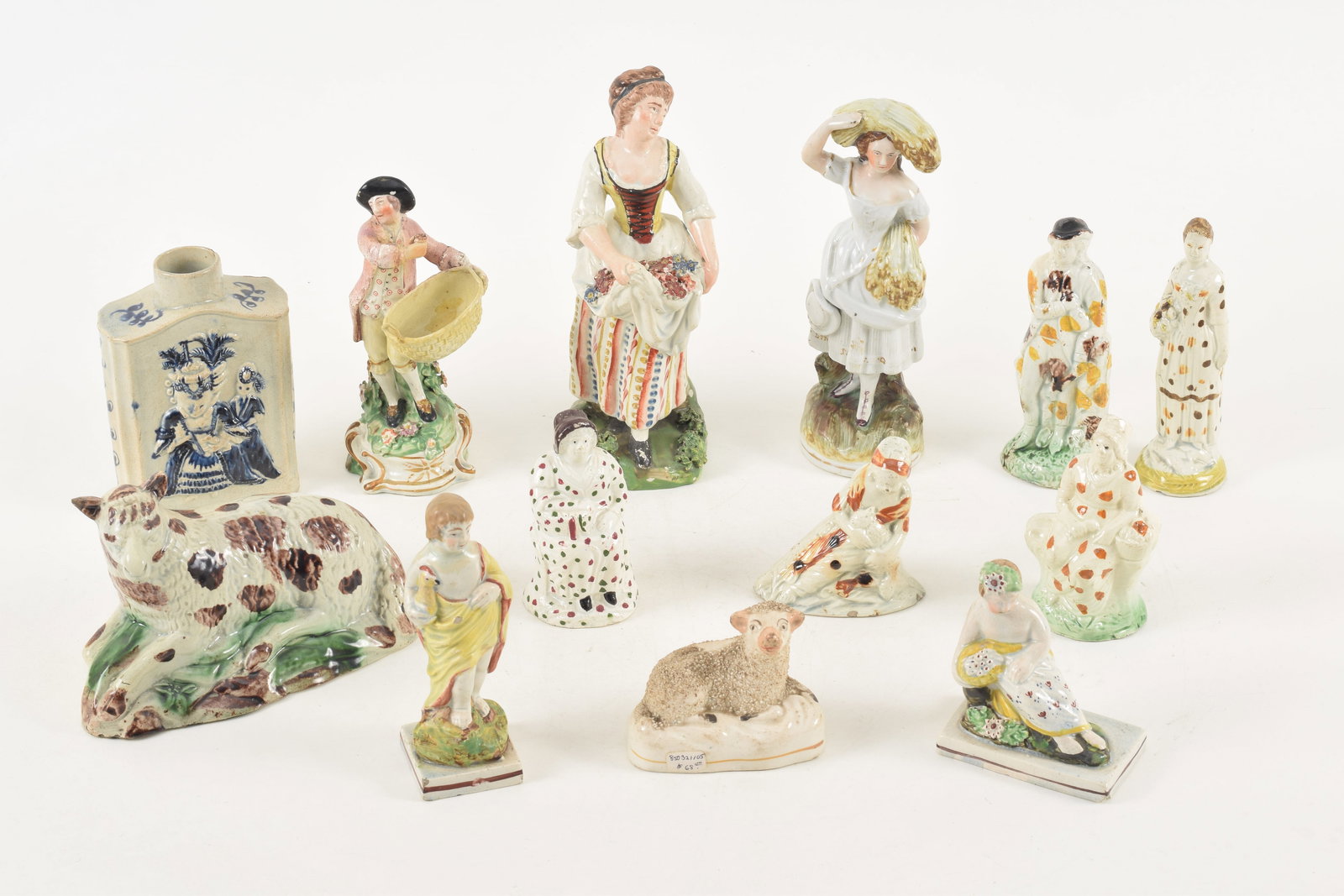 13 Early 19th Century Prattware and Staffordshire figures and animals with a tea caddy. Largest (1 of 10)