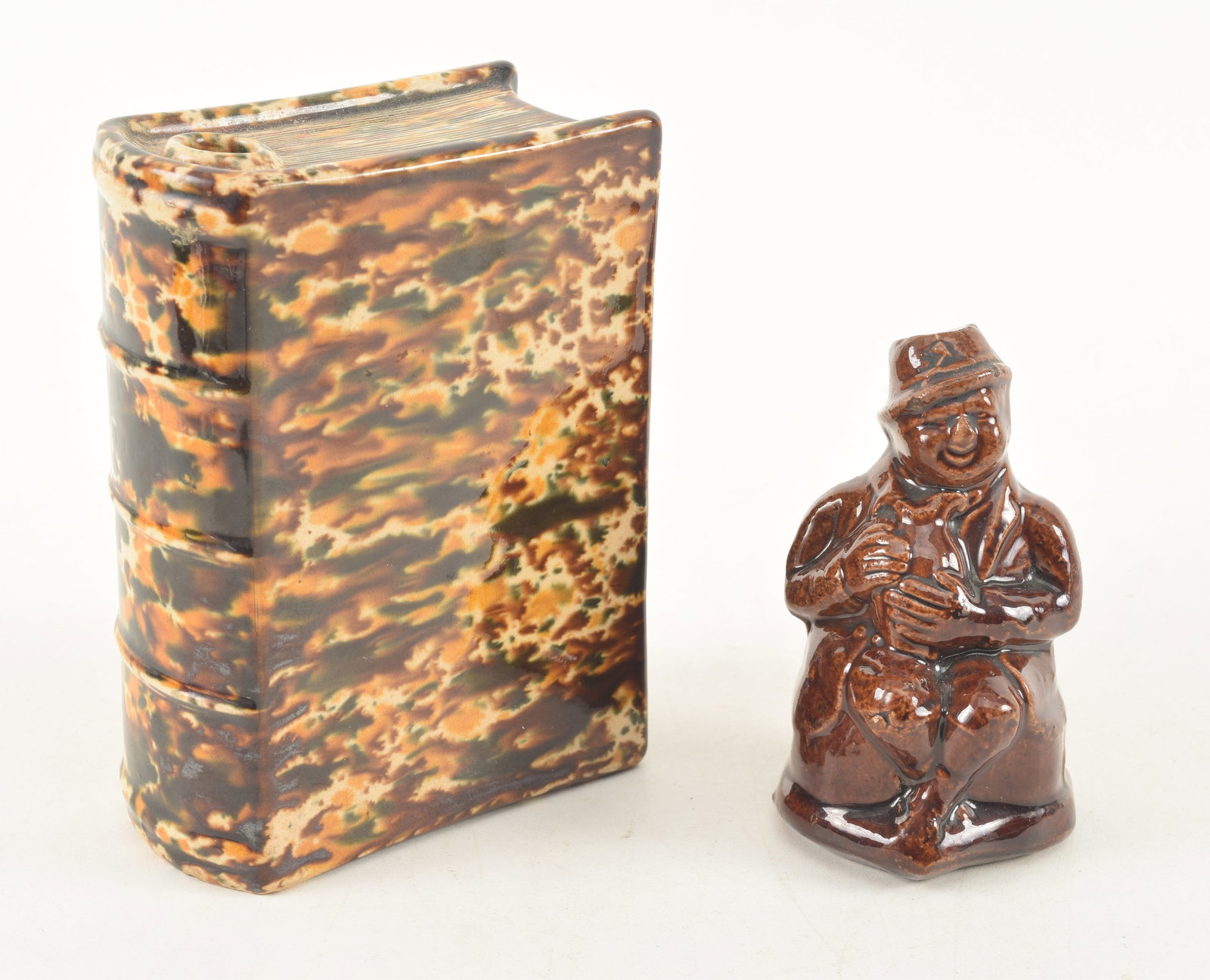 2 Bennington or Rockingham pottery items, a book form flash and the Jolly Man form bank, 19th (1 of 6)
