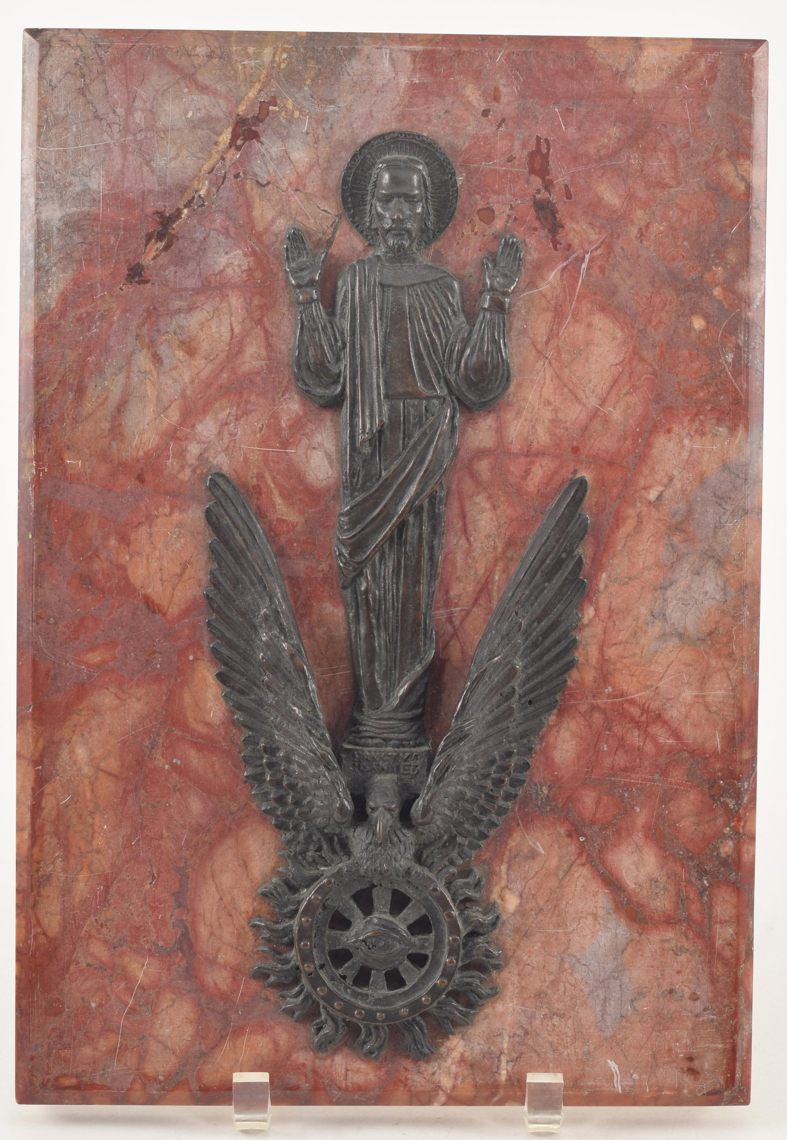 Art Deco bronze relief sculpture of Saint John mounted to a red marble plaque. Appears unsigned.: Art Deco bronze relief sculpture of Saint John mounted to a red marble plaque. Appears unsigned. Plaque repaired at upper left corner. Overall: 13.75 x 9.5in.