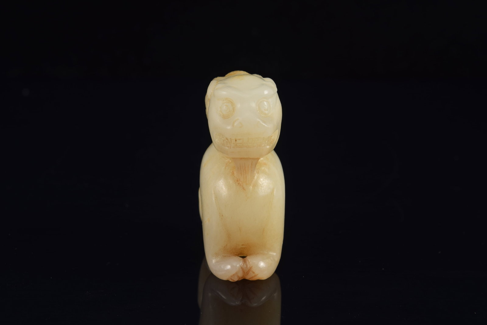 Jade carving of a buddhist lion. China. 19th century or earlier. Stone of a white color with russet - 2