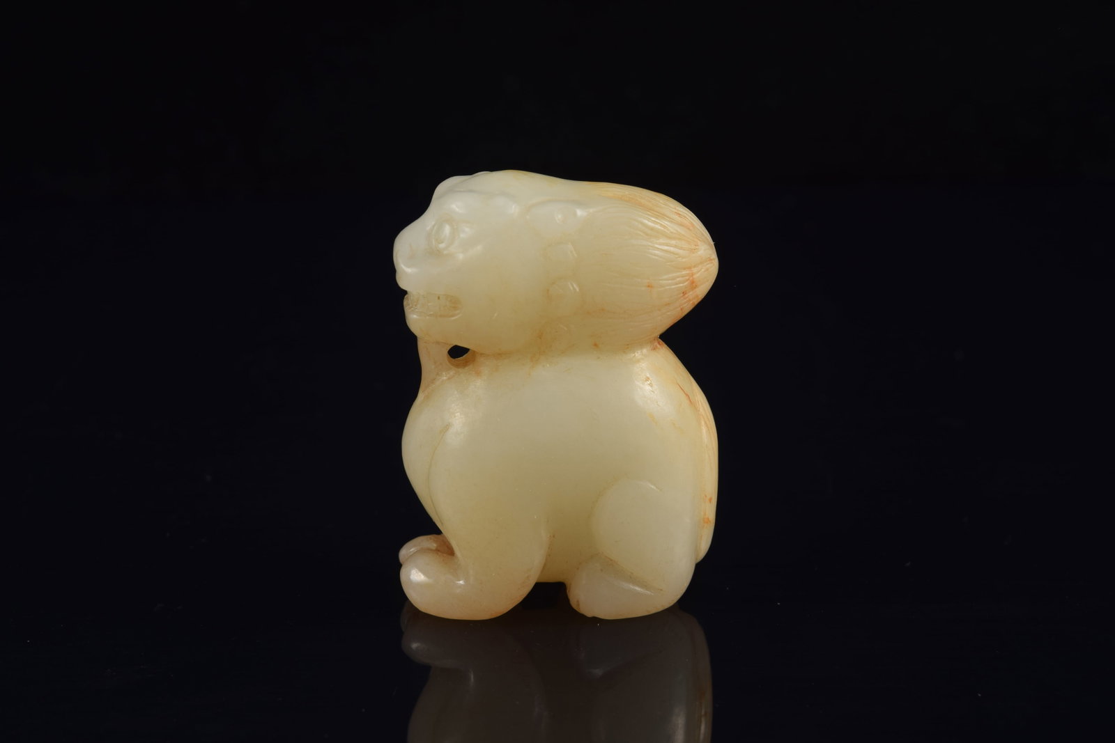 Jade carving of a buddhist lion. China. 19th century or earlier. Stone of a white color with russet - 3