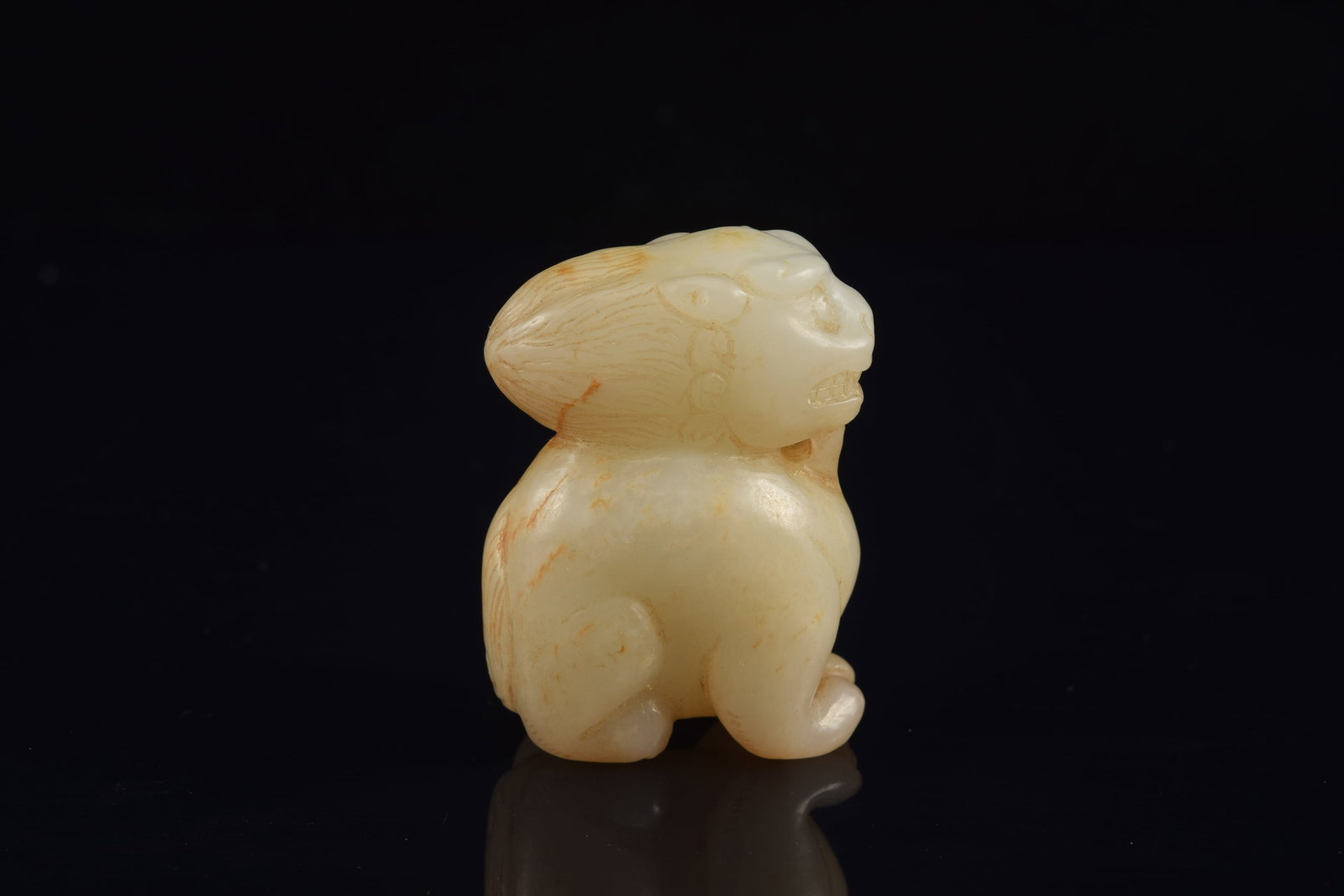 Jade carving of a buddhist lion. China. 19th century or earlier. Stone of a white color with russet - 5