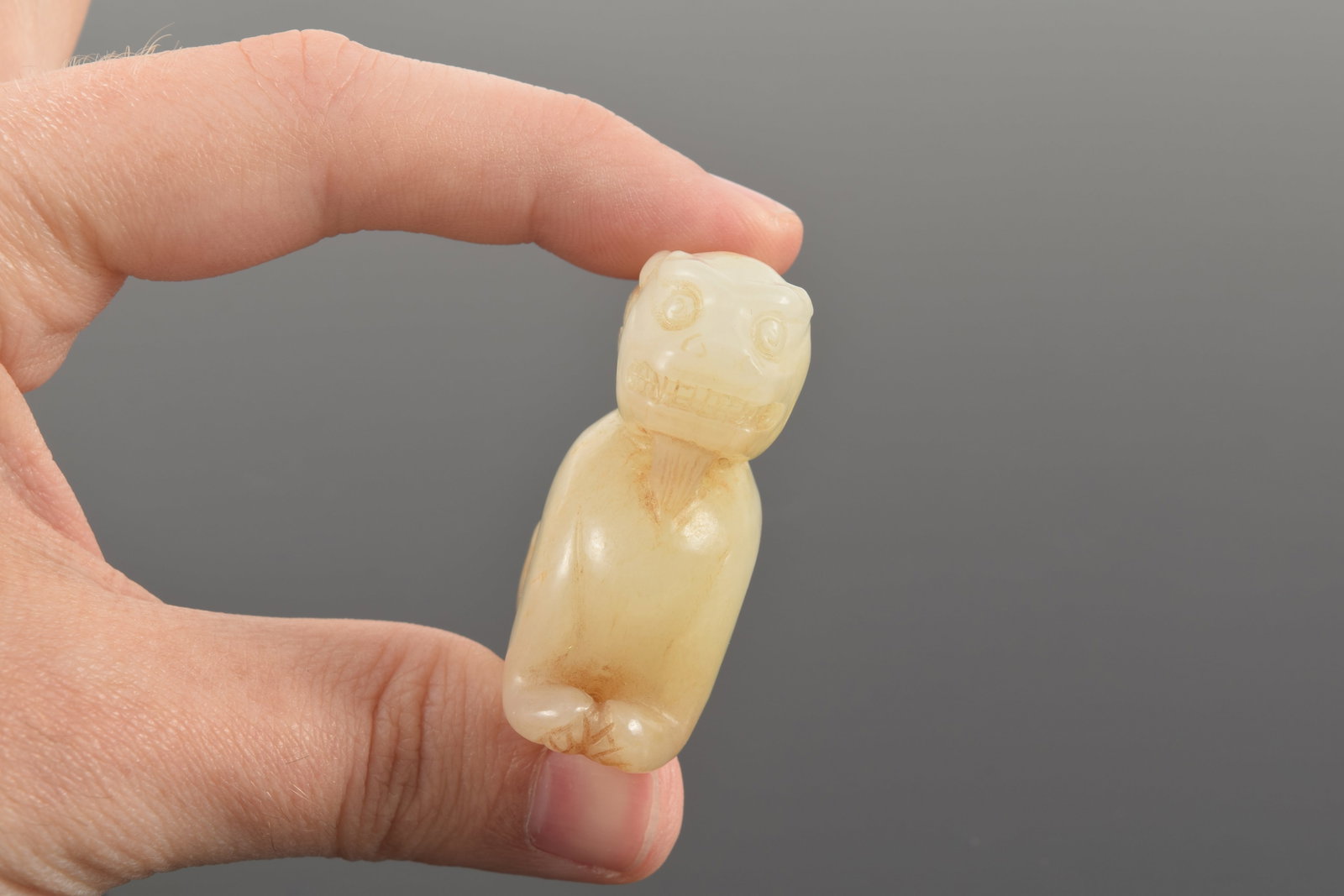Jade carving of a buddhist lion. China. 19th century or earlier. Stone of a white color with russet - 6