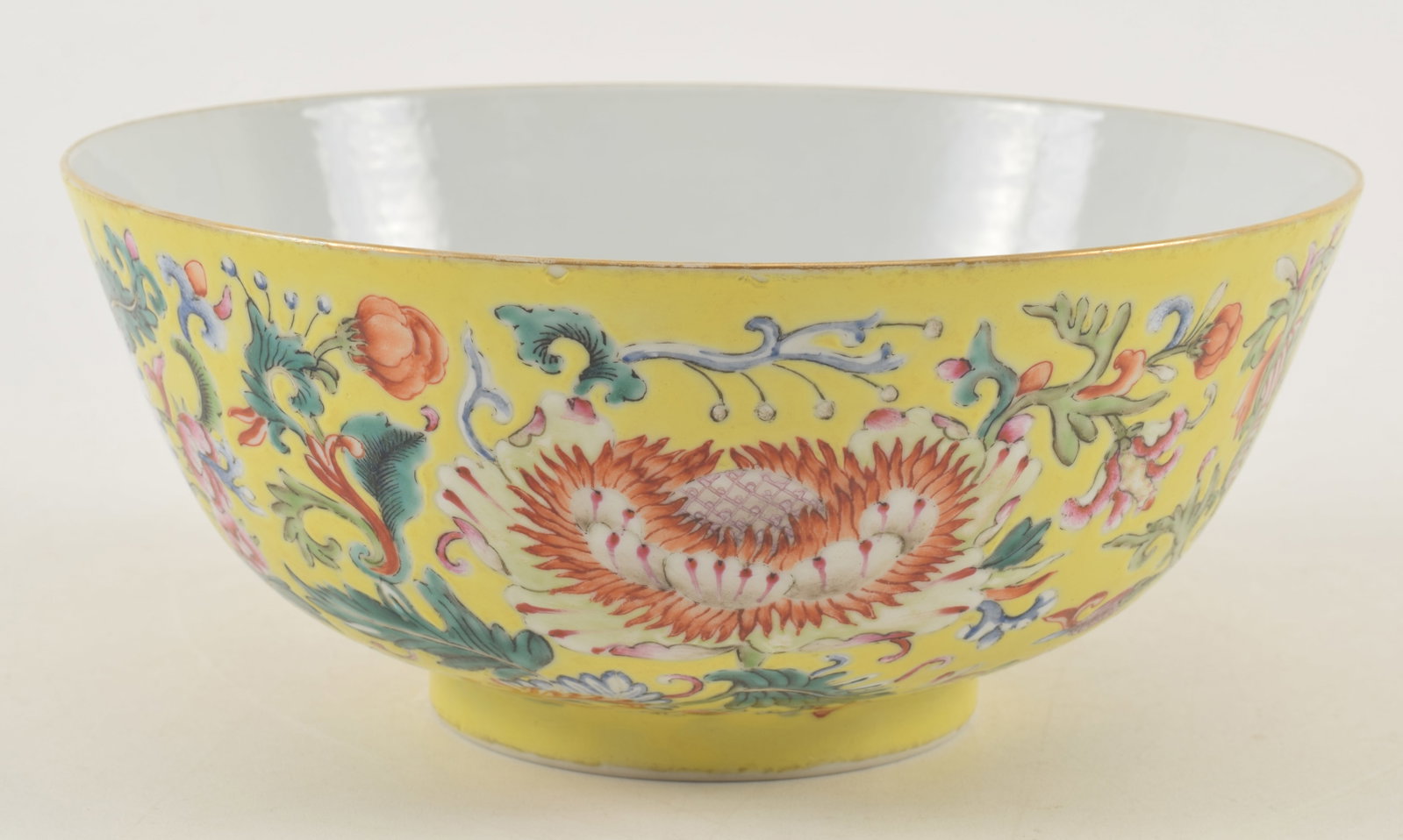 Porcelain bowl. China. Kuang Hsu mark and period. Stylized flowers on a yellow ground. 7.75: Porcelain bowl. China. Kuang Hsu mark and period. Stylized flowers on a yellow ground. 7.75 diameter.