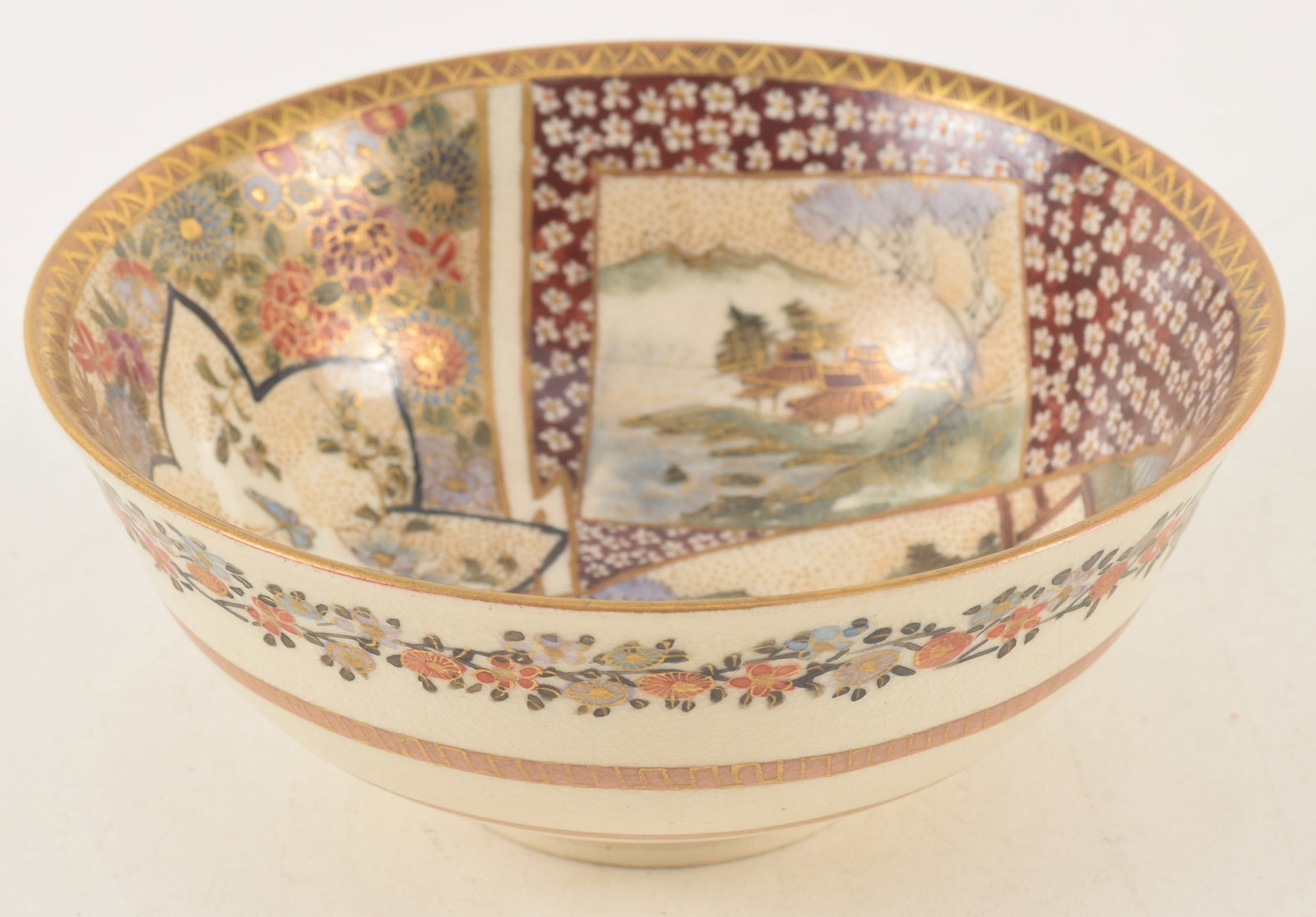 Satsuma bowl. Japan. Meiji period (1868-1912). Decoration of people and flowers. 4.25in diameter. (1 of 5)