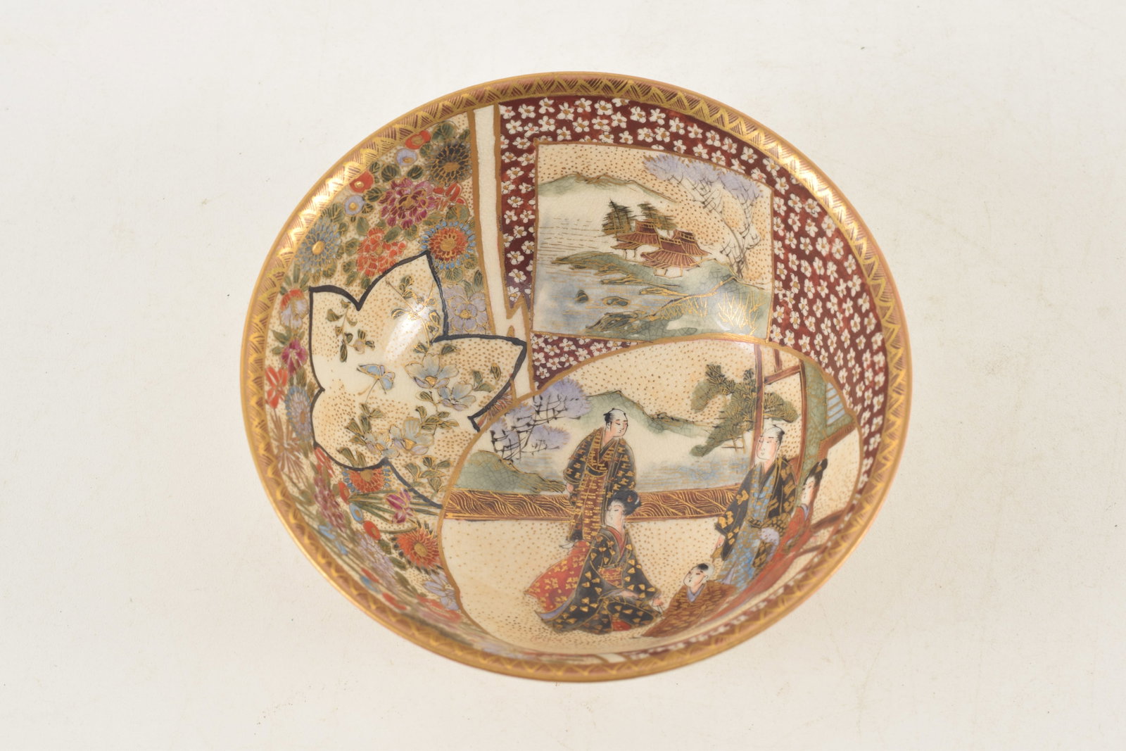 Satsuma bowl. Japan. Meiji period (1868-1912). Decoration of people and flowers. 4.25in diameter. - 2