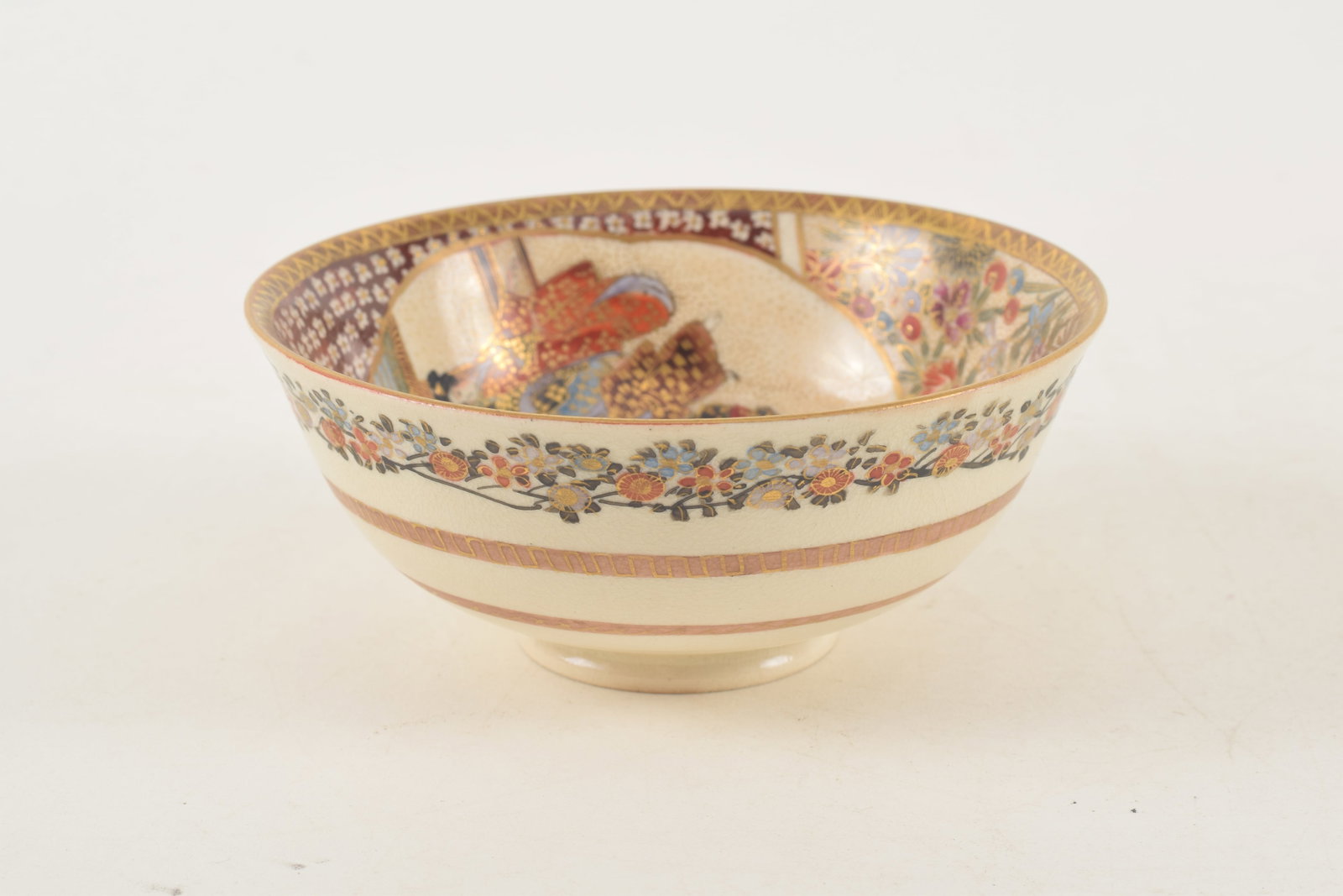 Satsuma bowl. Japan. Meiji period (1868-1912). Decoration of people and flowers. 4.25in diameter. - 4