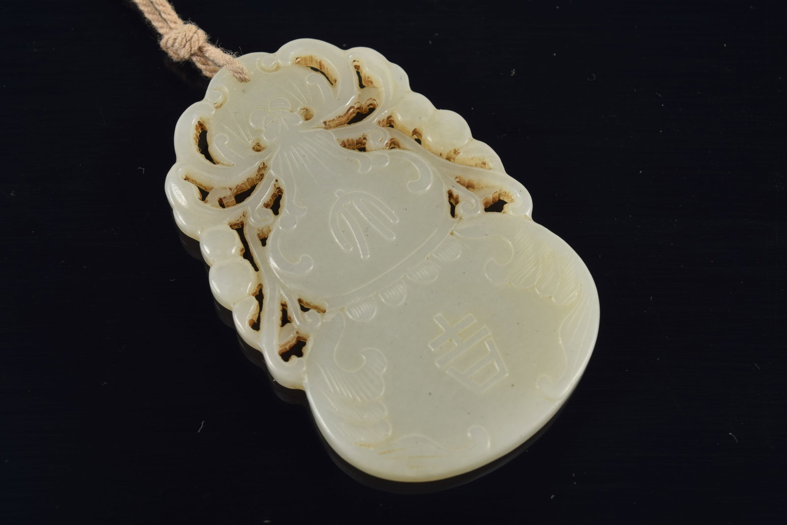 Jade pendant. China. 19th century. Double gourd form. 2.25in. - 3